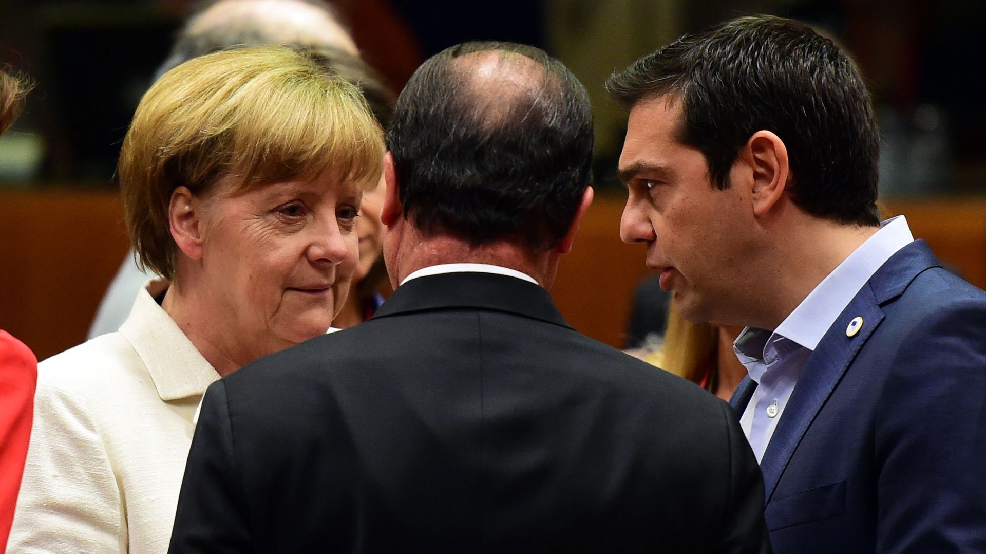 La chancelière allemande Angela Merkel, le président français François Hollande, et le Premier ministre grec Alexis Tsipra lors du sommet de l'Eurogroupe le 12 juillet 2015 à Bruxelles
