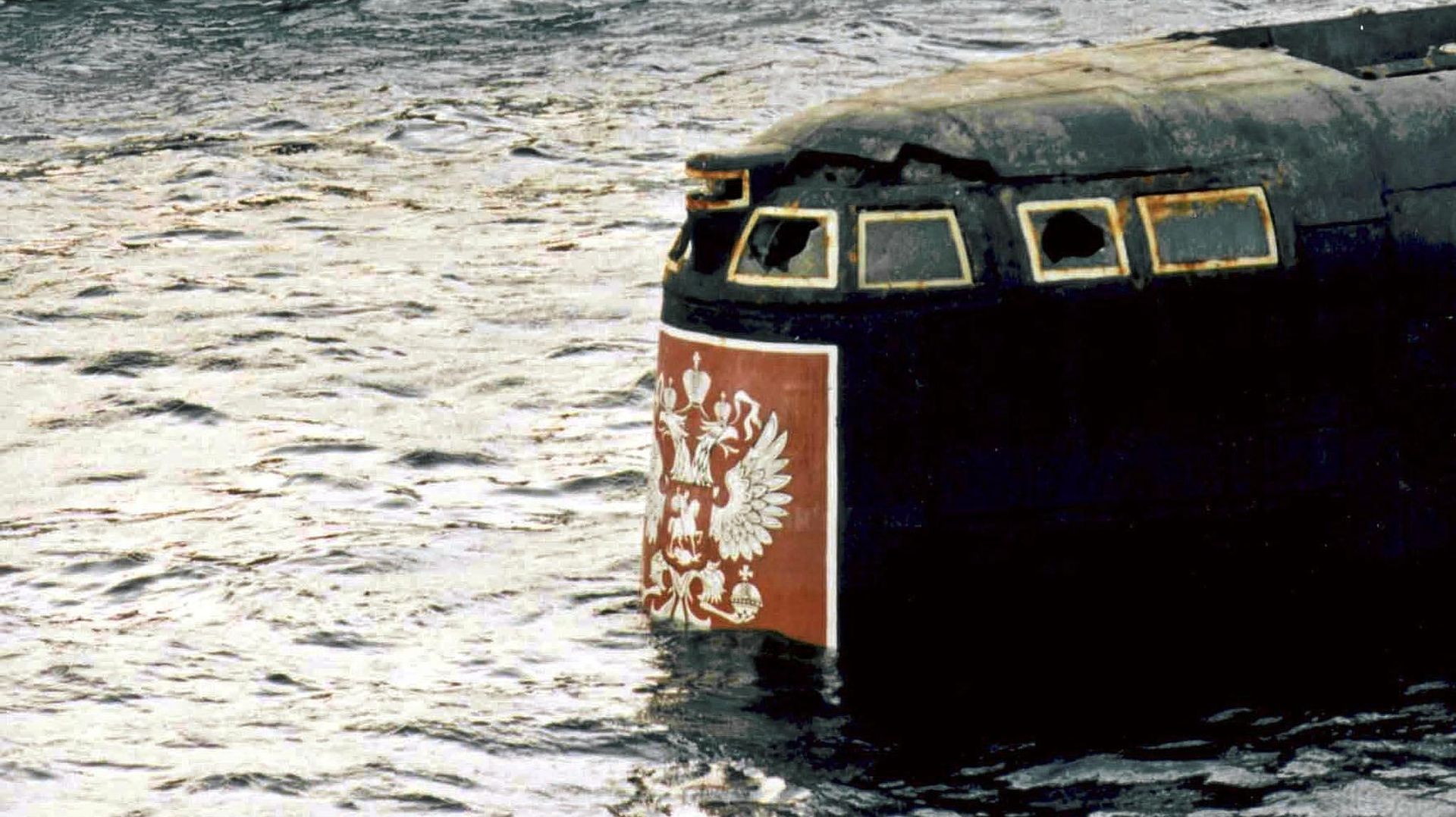 The conning tower of the Kursk nuclear submarine appears at the surface in the port of Roslyakovo, near Murmansk, 23 October 2001