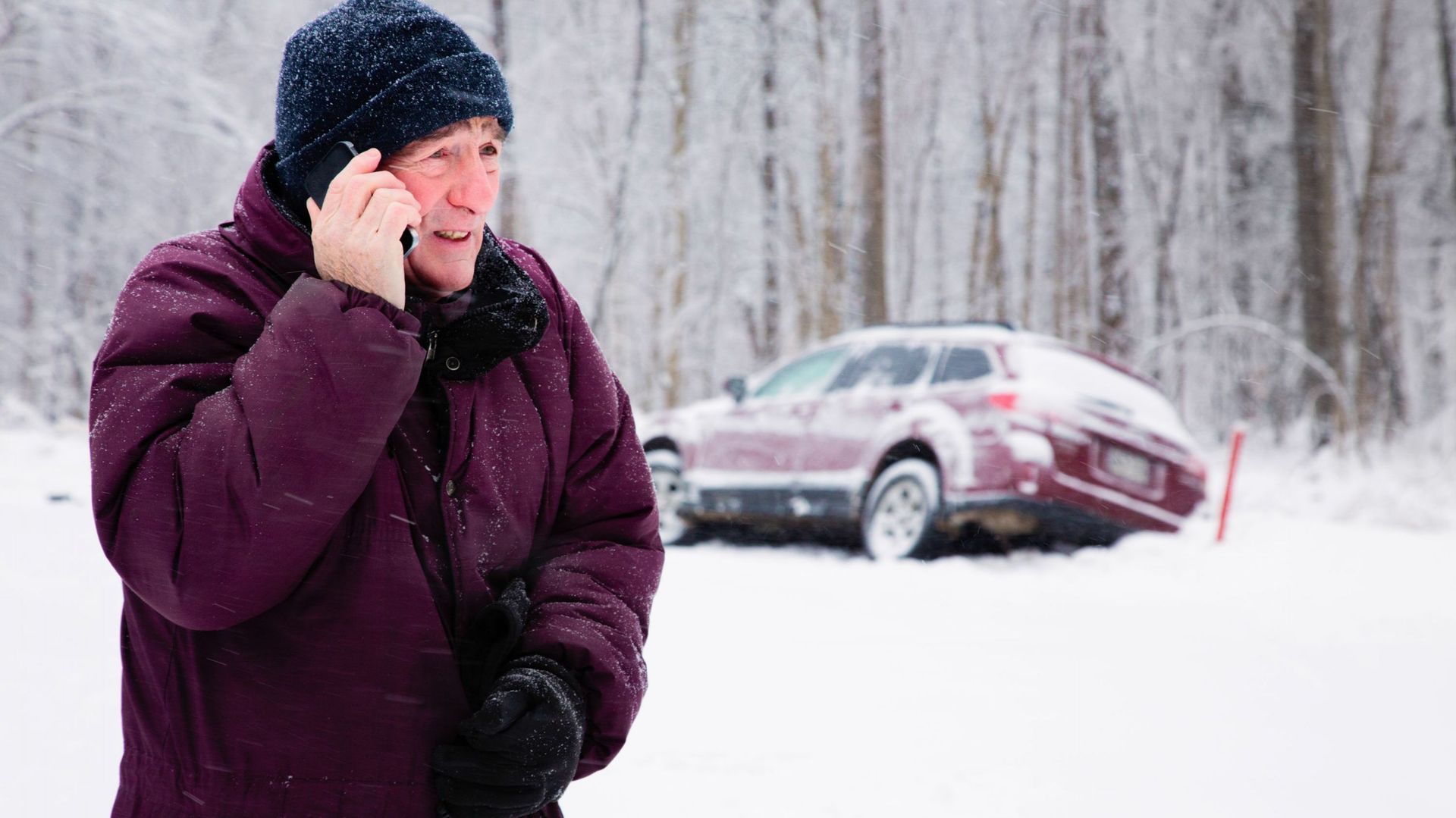 Senior man calling for help during snow storm