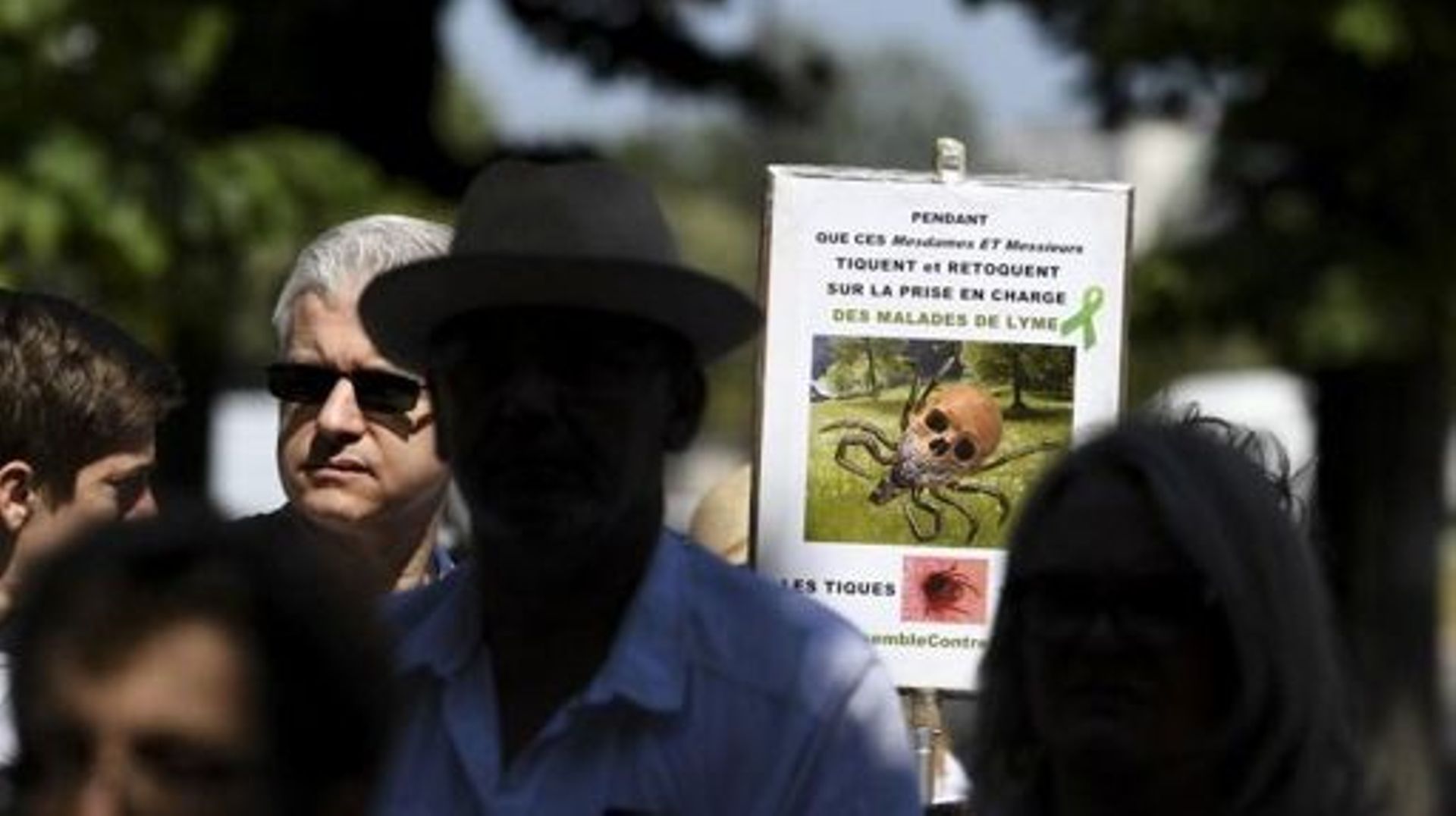 Demonstrators take part in a gathering called by the Together against Lyme movement, asking for a better recognition of the Lyme disease by the French Government, on July 3, 2019, in Paris. Demonstrators asked for concrete solutions and deplored the lack 