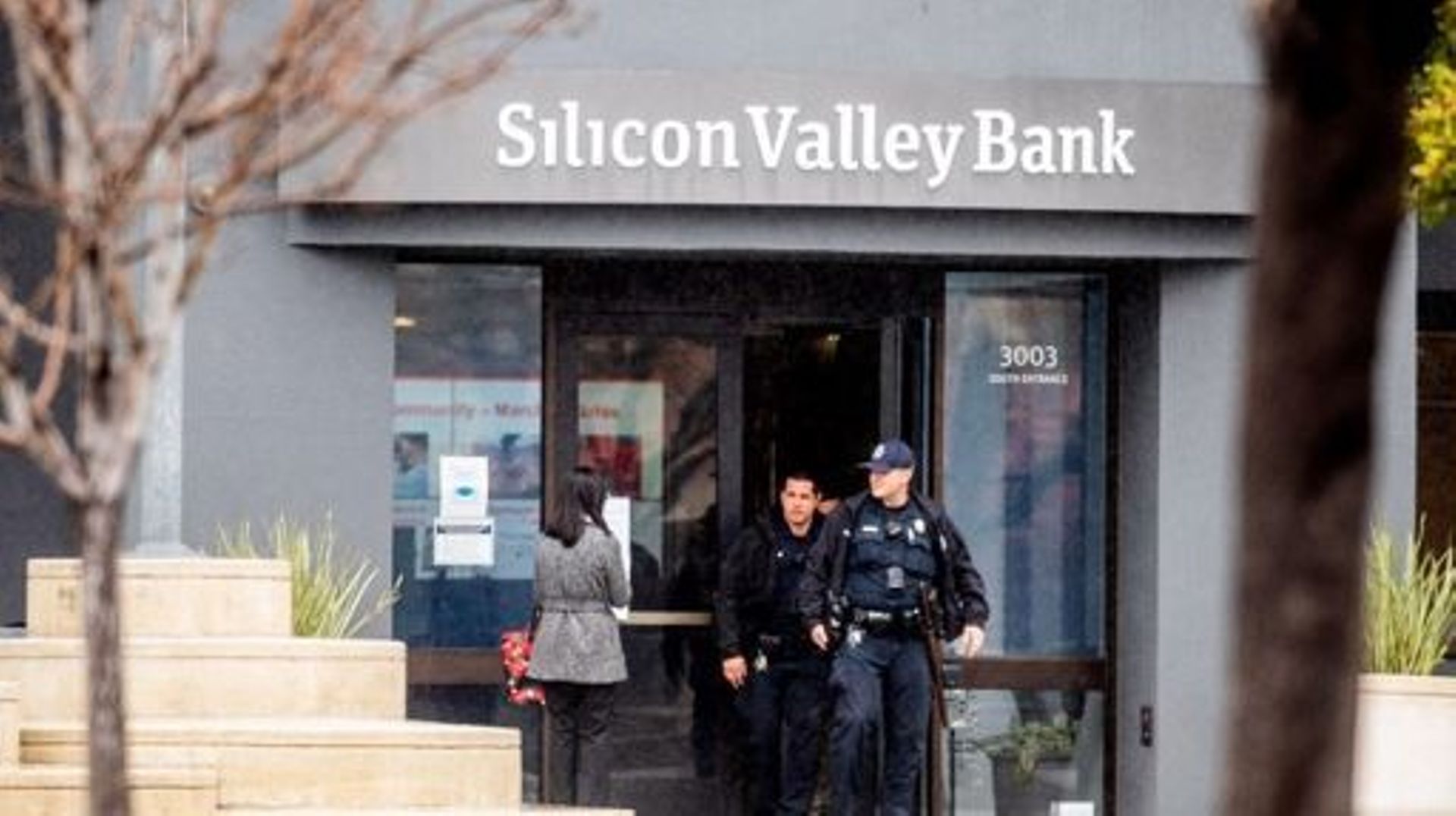 Police officers leave Silicon Valley Bank's headquarters in Santa Clara, California on March 10, 2023. US authorities swooped in and seized the assets of SVB, a key lender to US startups since the 1980s, after a run on deposits made it no longer tenable f