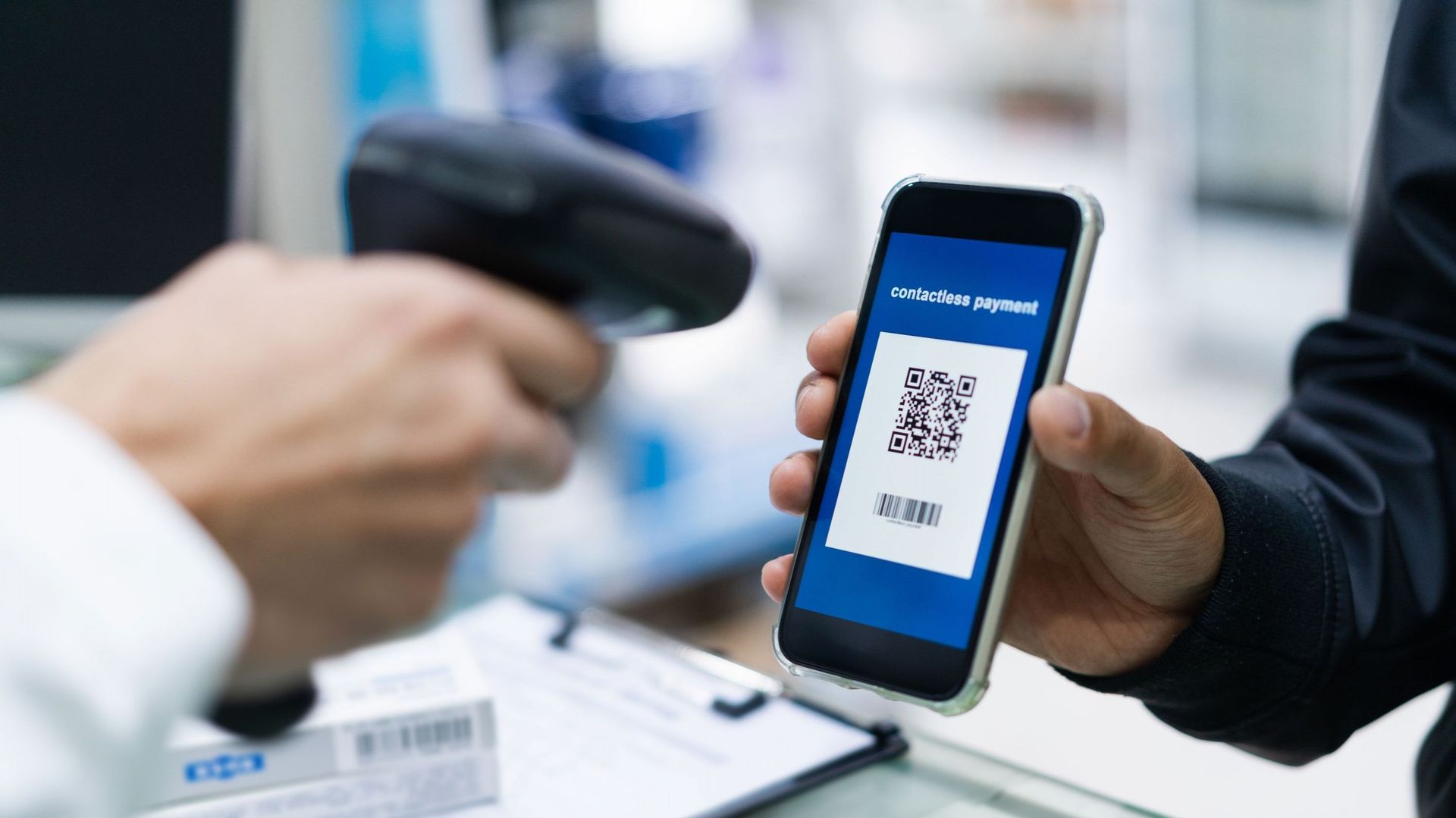 Contactless payment with QR code in smartphone.