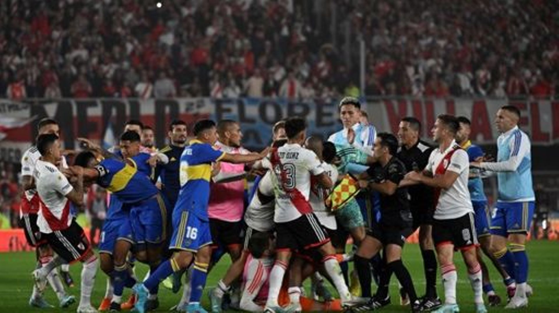 Players of both teams scuffle after incidents following River Plate's penalty goal during the Argentine Professional Football League Tournament 2023 match between River Plate and Boca Juniors at El Monumental stadium in Buenos Aires on May 7, 2023.  Luis 