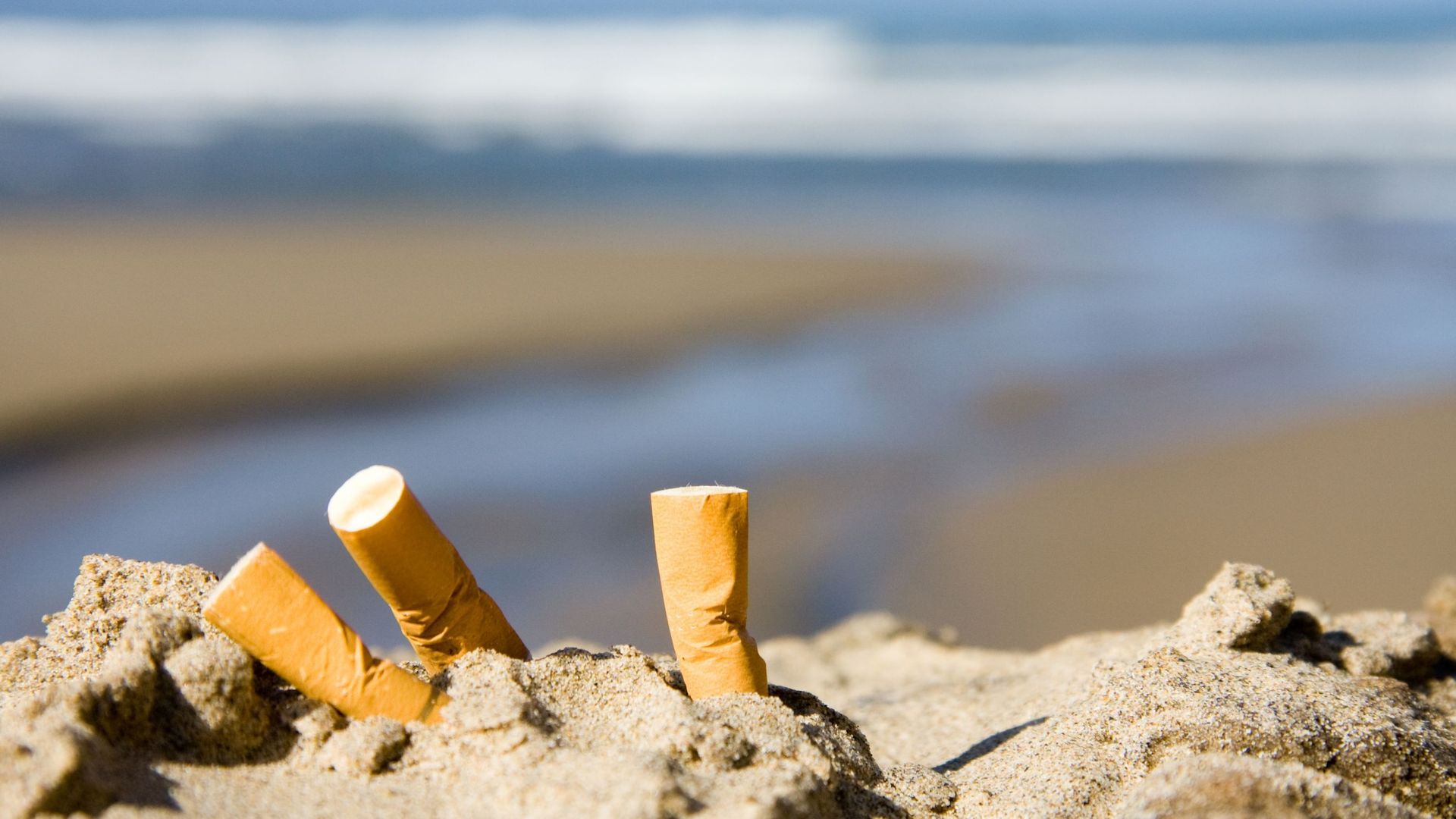 three cigarettes on beach