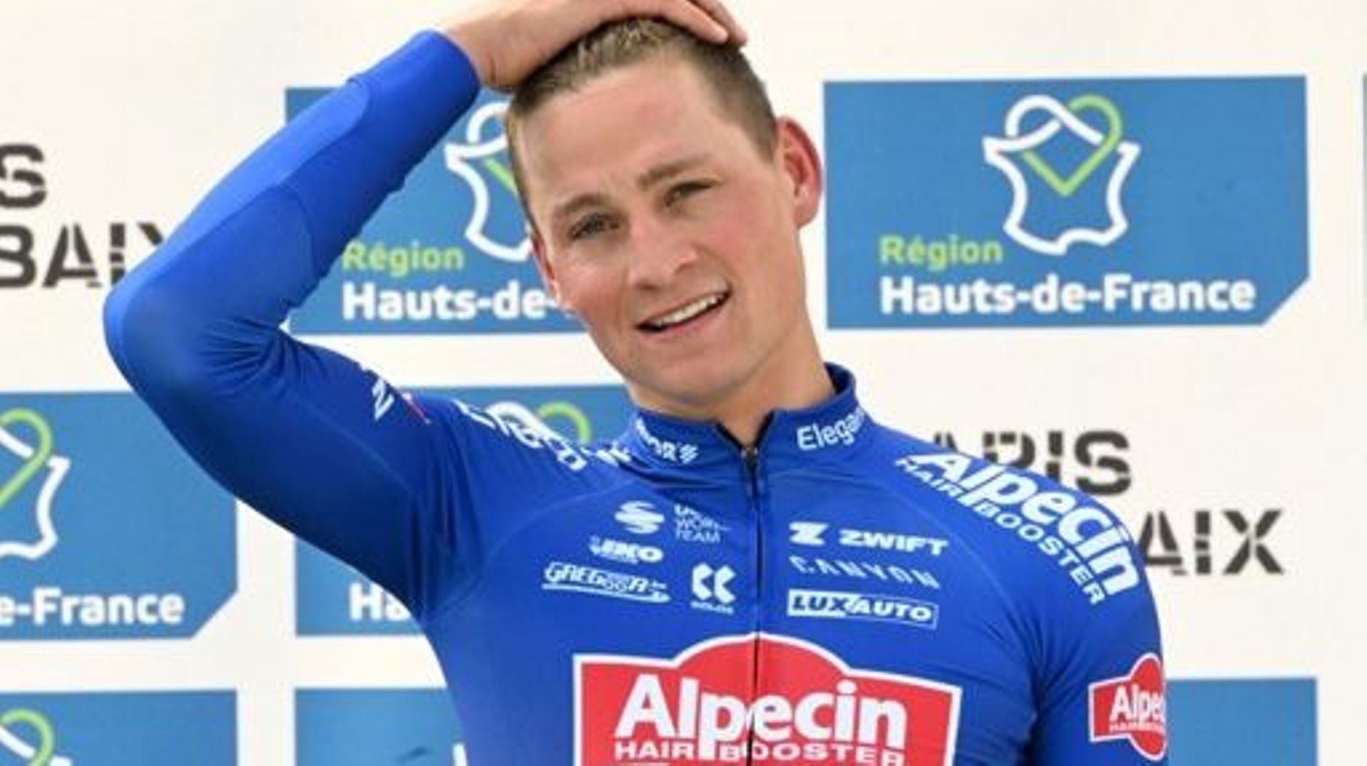 Winner Alpecin-Deceuninck team’s Dutch rider Mathieu Van Der Poel reacts as he celebrates on the podium after winning the 120th edition of the Paris-Roubaix one-day classic cycling race, between Compiegne and Roubaix, northern France, on April 9, 2023. F