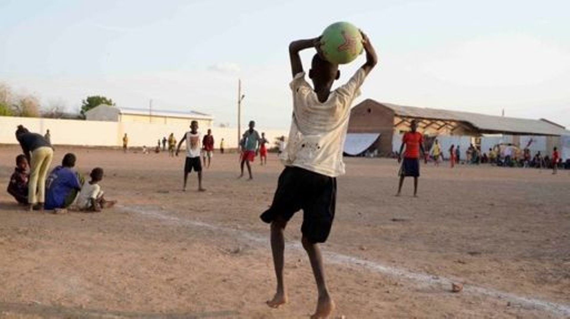 Internally displaced Sudanese youths play football while residing in the Hasahisa secondary school on July 10, 2023, transformed to house people fleeing violence in the war-torn country. Conflict-torn Sudan is on the brink of a "full-scale civil war" that