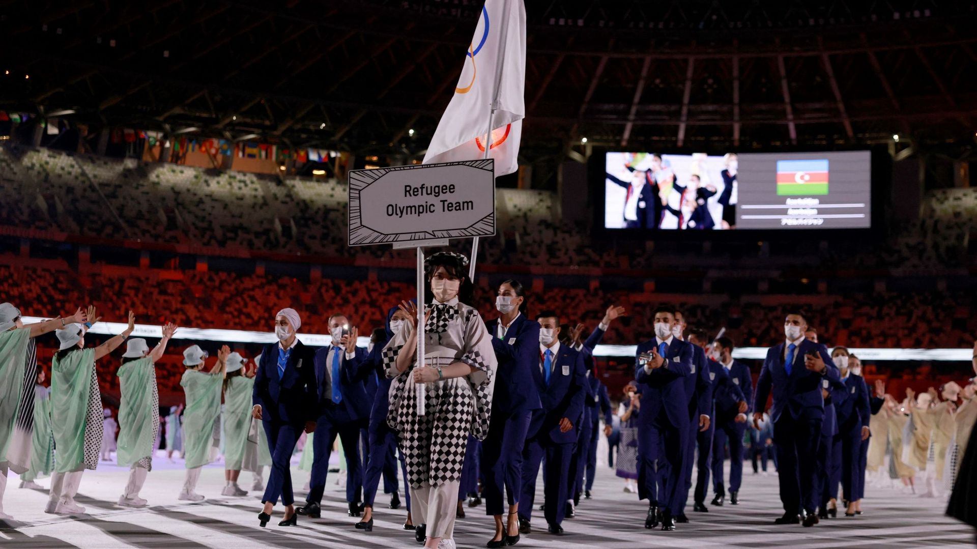 Des membres de l’équipe olympique des réfugiés participaient à la cérémonie d’ouverture à Tokyo
