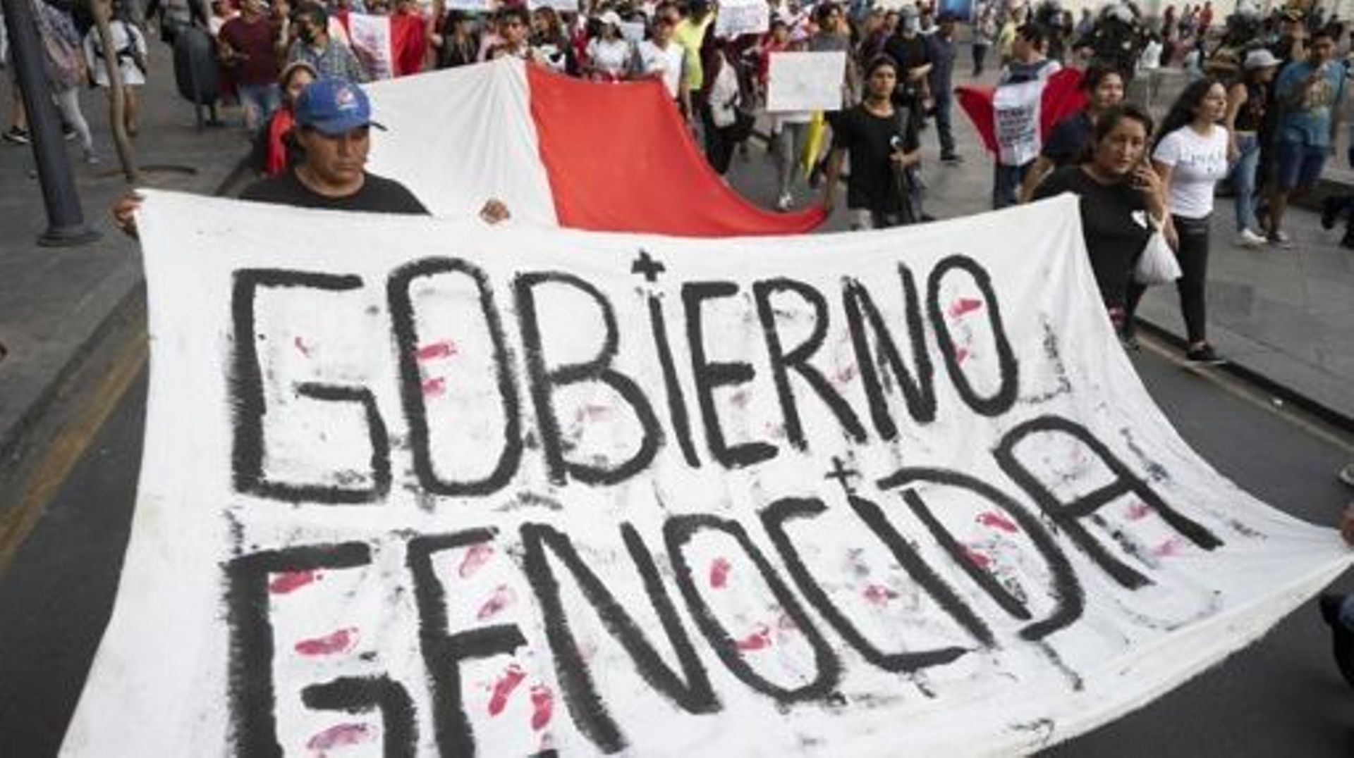 People march during a demonstration against the government of Peruvian President Dina Boluarte calling for her resignation and the closure of Congress in Lima on February 4, 2023. Hundreds of protesters gathered at the accesses to Lima to attend a march t