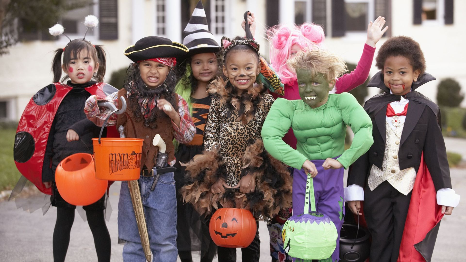 Children (4-7) dressed up for Halloween, group portrait