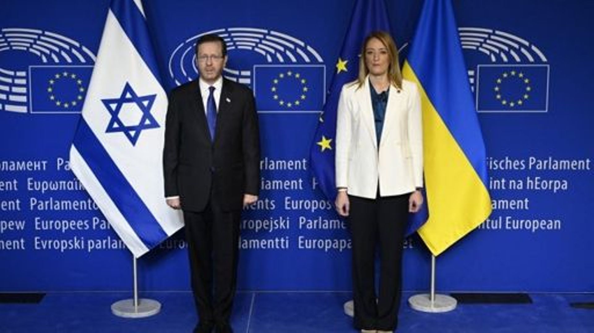 European Parliament President Roberta Metsola (R) welcomes President of the State of Israel Isaac Herzog before a plenary session for the Commemoration of the International Holocaust Remembrance Day at the European Parliament at the EU headquarters in Bru