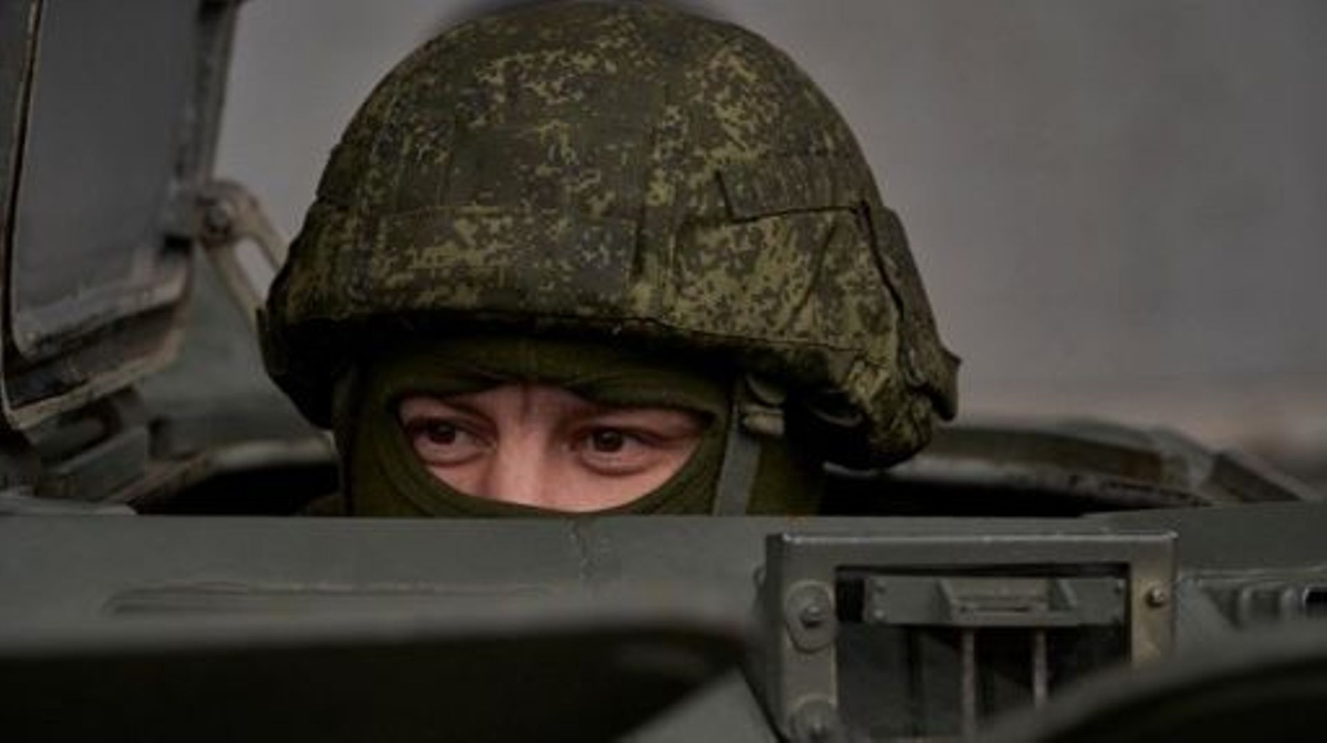 A Russian serviceman keeps watch from the hatch of a military vehicle as the delegation of the International Atomic Energy Agency (IAEA), including its head Rafael Grossi, visits the Russian-controlled Zaporizhzhia nuclear power plant in southern Ukraine.