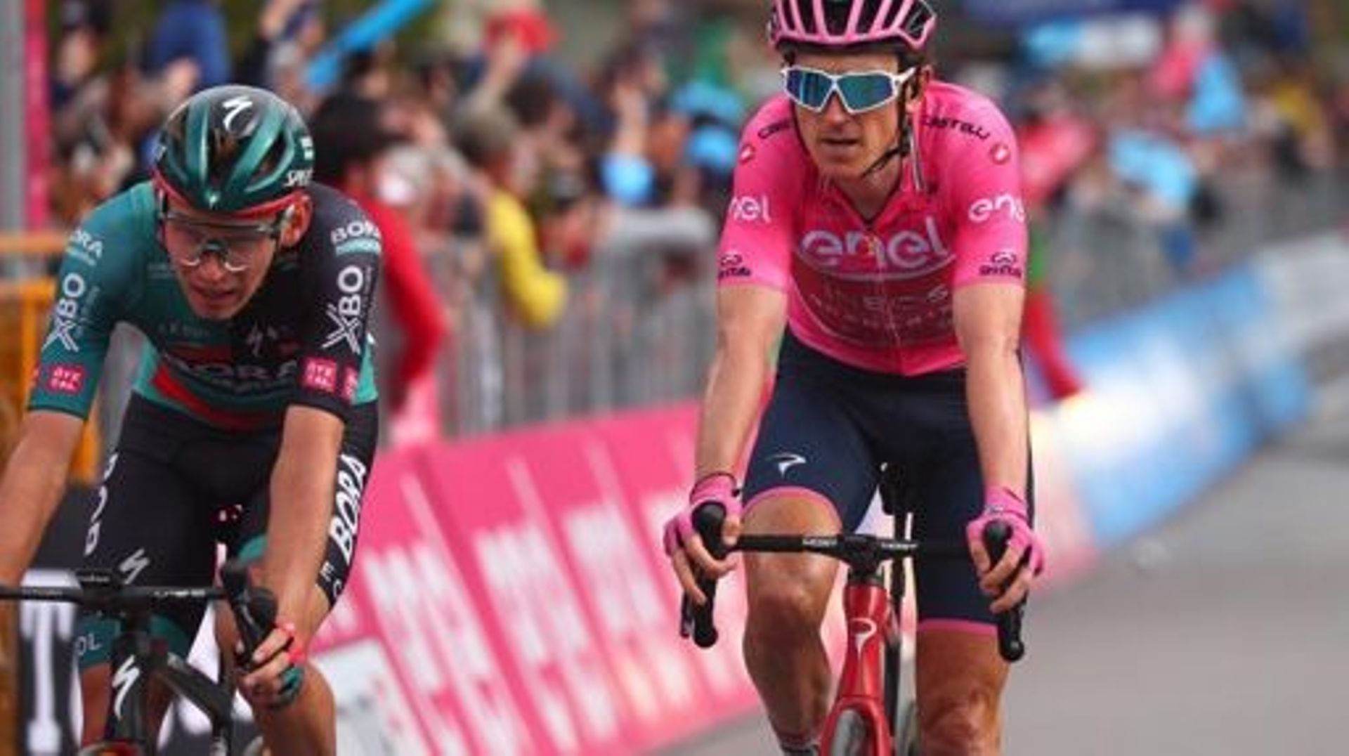 BORA – hansgrohe’s Russian rider Aleksander Vlasov (L) and overall elader INEOS Grenadiers’s British rider Geraint Thomas cross the finish line the thirteenth stage of the Giro d’Italia 2023 cycling race, which start was transfered from Borgofranco d’Ivre