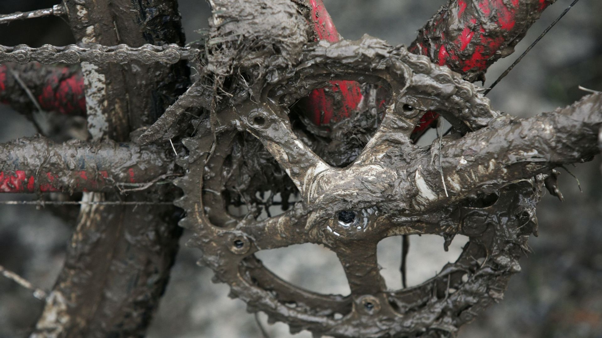 A close up view of a muddy cyclo-cross bike.