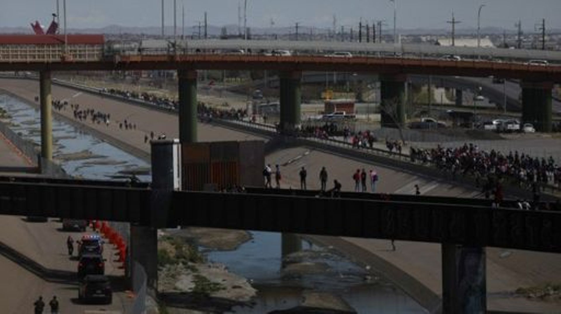 Migrants, mostly of Venezuelan origin, attempt to forcibly cross into the United States at the Paso del Norte International Bridge in Ciudad Juarez, Chihuahua state, Mexico, on March 12, 2023. Hundreds of migrants, mostly Venezuelans, attempted to stamped