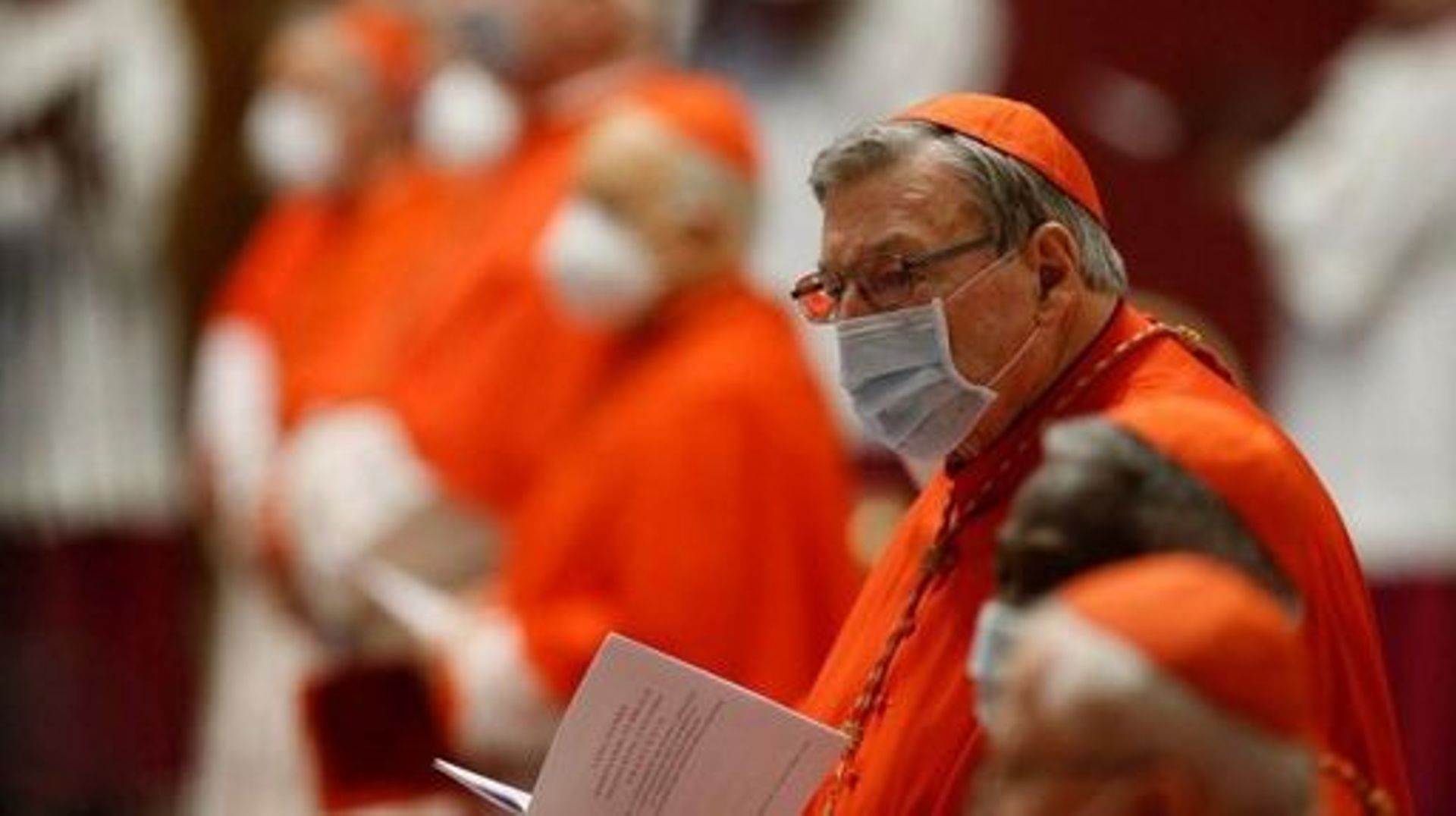 Australian Cardinal George Pell, wearing a face mask, attends a Pope’s a consistory to create 13 new cardinals, on November 28, 2020 at St. Peter’s Basilica in The Vatican. FABIO FRUSTACI / POOL / AFP