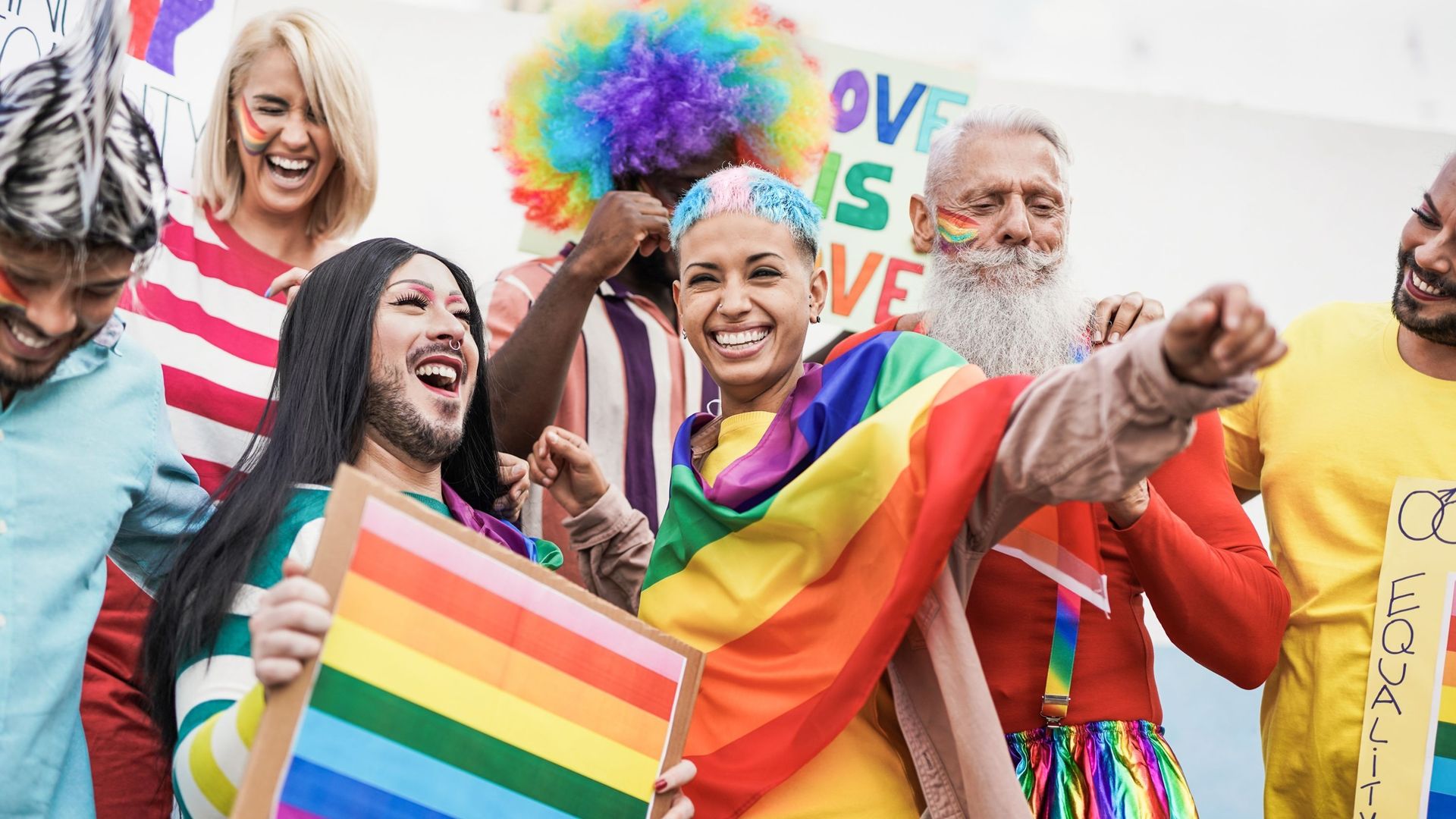 People from different generations have fun at gay pride parade with banner – Lgbt and homosexual love concept