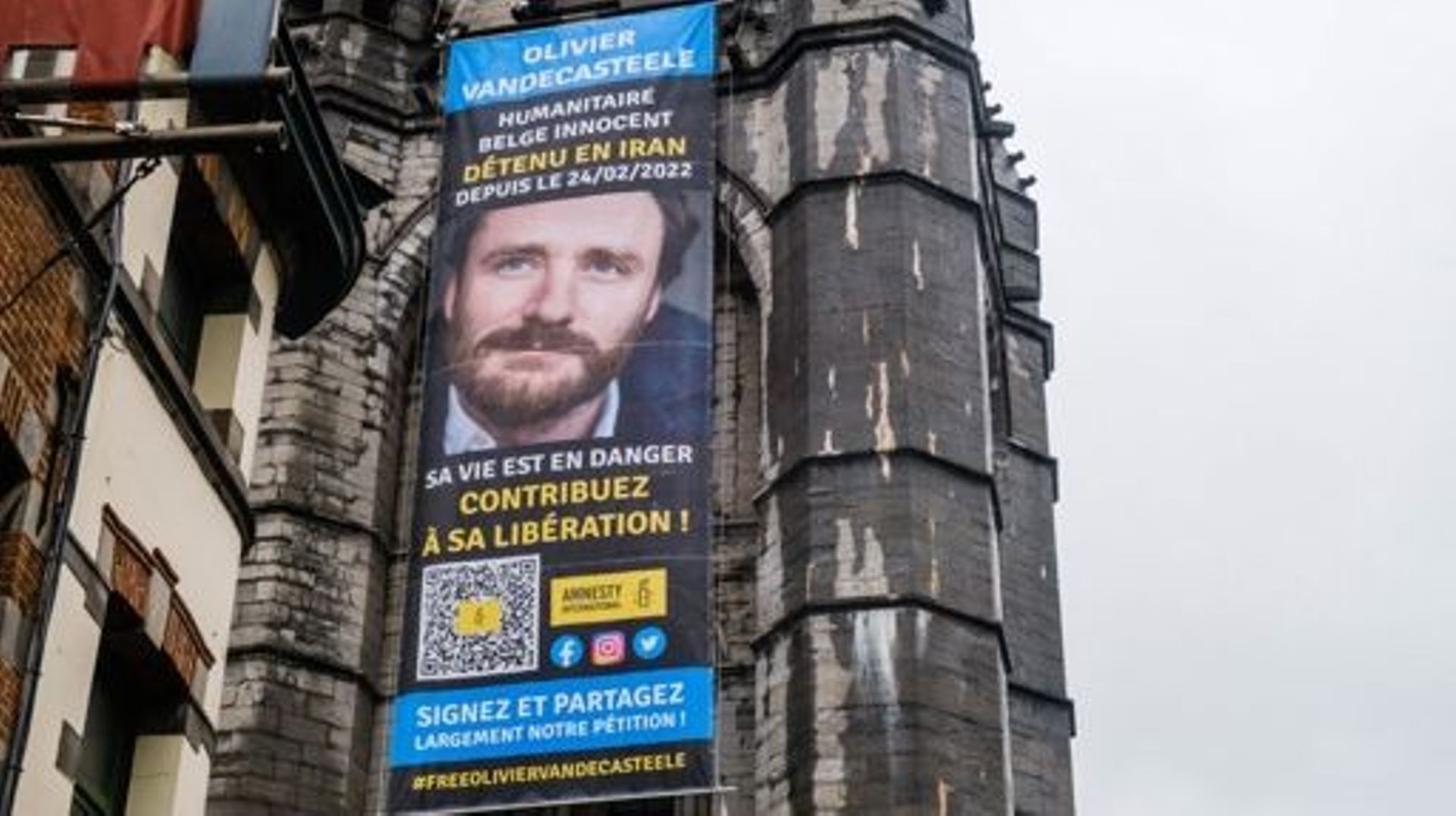 Illustration picture shows the installation of a large banner with a portrait of Belgian NGO-worker Olivier Vandecasteele, in Tournai (Doornik), Thursday 12 January 2023. Olivier Vandecasteele is a Belgian humanitarian worker who has worked for more than