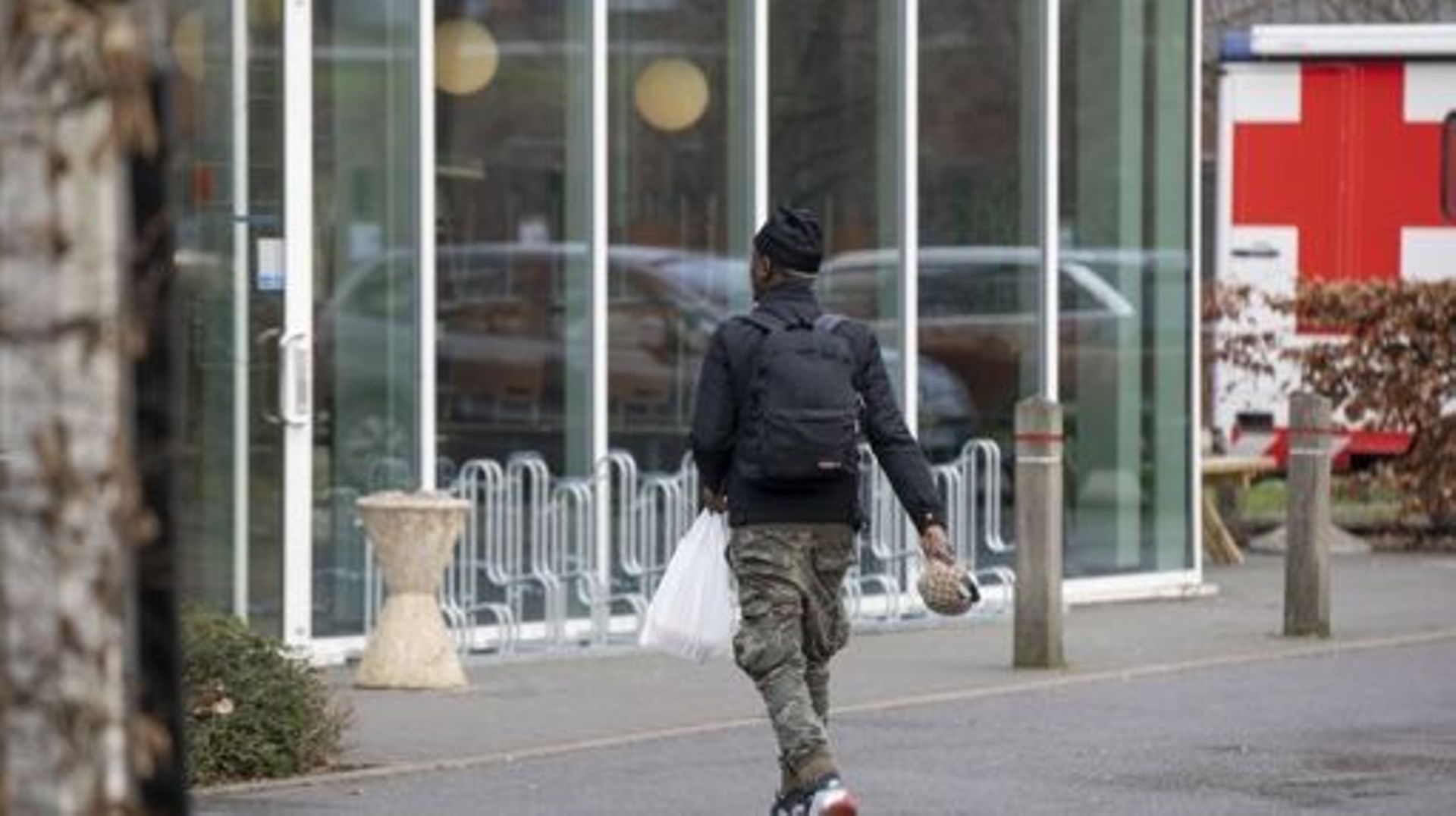 Illustration picture shows a man around the Ibis Budget Hotel in Ruisbroek, Sint-Pieters-Leeuw, Thursday 16 February 2023. Following the evacuation of the squatted so-called Palais des Droits – Rechtenpaleis building, at the Paleizenstraat – Rue des Palai