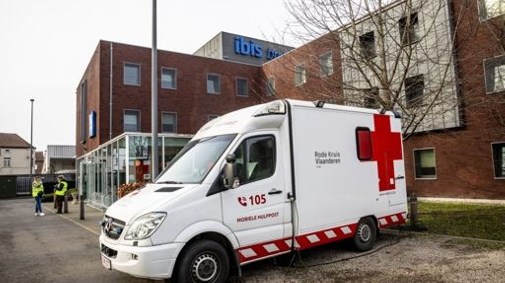 Illustration picture shows a red cross vehicle at the Ibis Budget Hotel in Ruisbroek, Sint-Pieters-Leeuw, Thursday 16 February 2023. Following the evacuation of the squatted so-called Palais des Droits – Rechtenpaleis building, at the Paleizenstraat – Rue