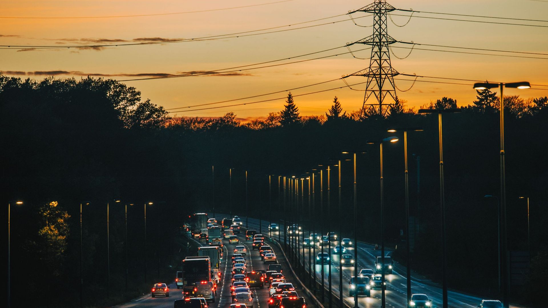 An aerial sunset view of a UK multi-lane highway - stock photo