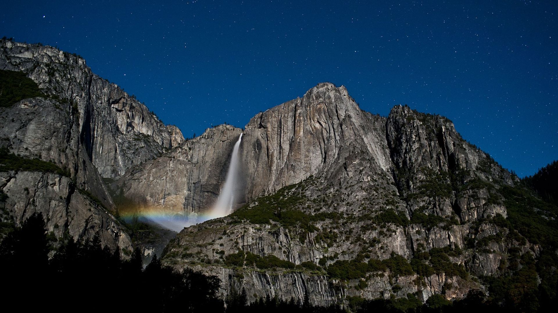 Moonbow and stars at Yosemite Falls, Yosemite National Park