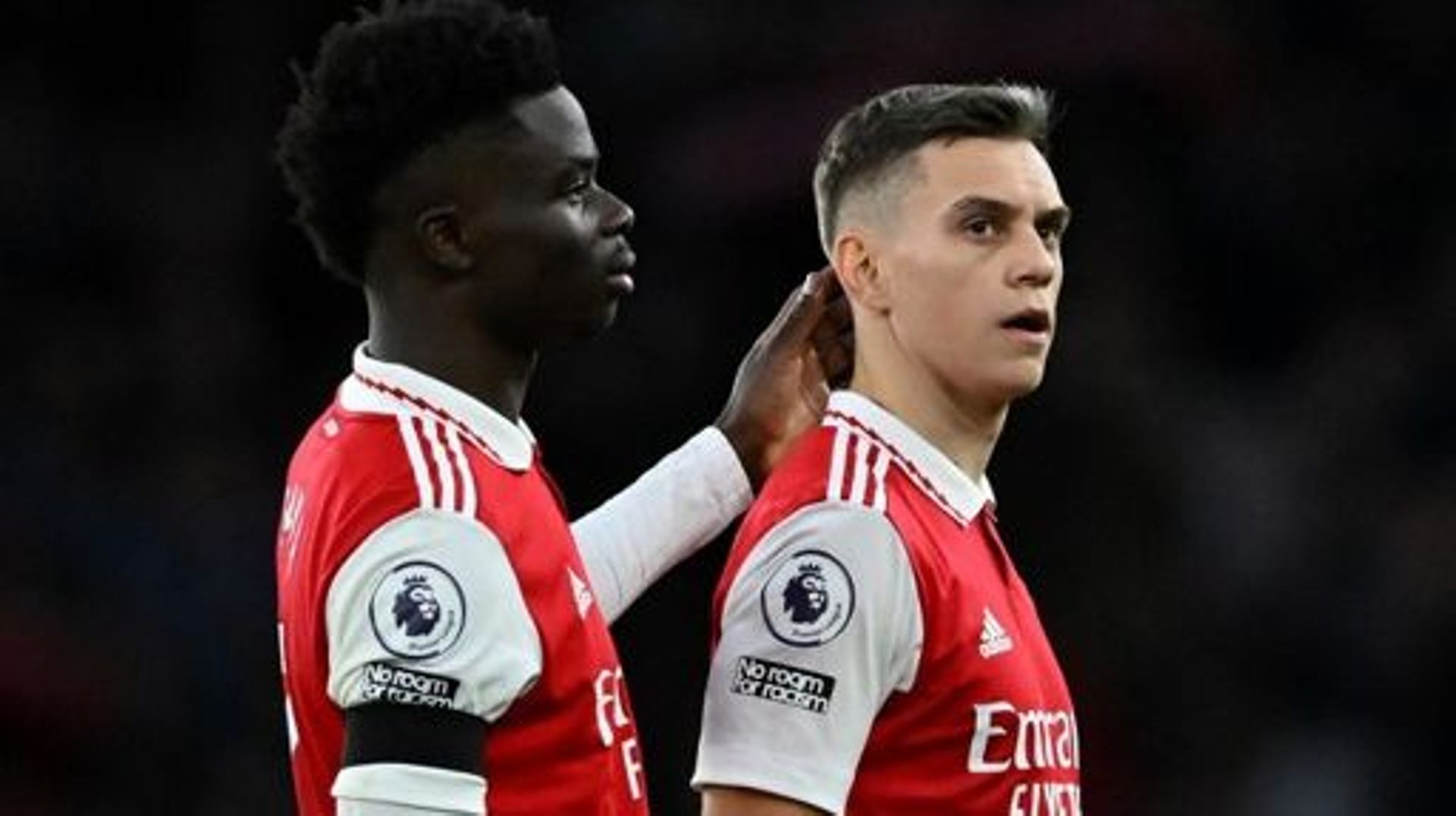 Arsenal’s English midfielder Bukayo Saka (L) and Arsenal’s Belgian midfielder Leandro Trossard react after the English Premier League football match between Arsenal and Brentford at the Emirates Stadium in London on February 11, 2023. JUSTIN TALLIS / AF