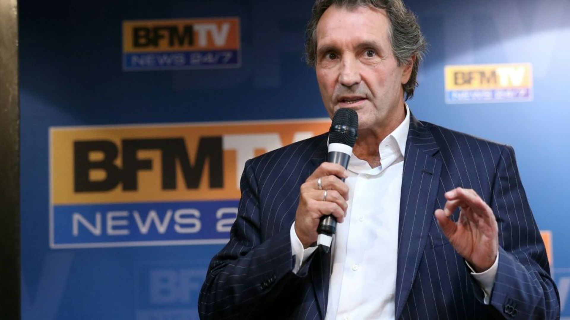 Le journaliste Jean-Jacques Bourdin lors de la présentation des programmes de la rentrée de BFMTV, en août 2013 à Paris