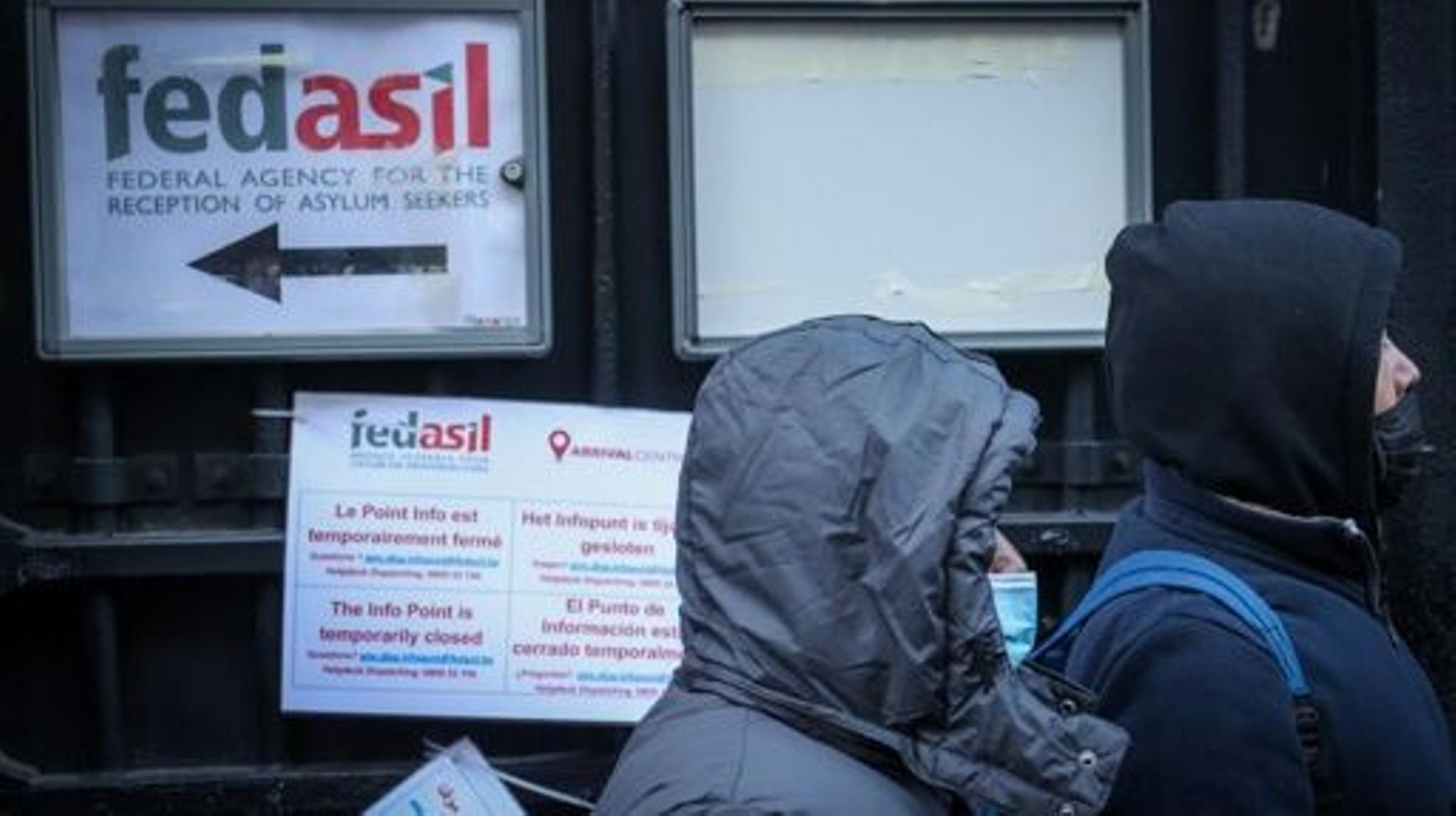 Illustration shows refugees waiting outside, in the cold, at the entry to the 'Klein Kasteeltje – Petit Chateau' (Little Castle) Fedasil registration center for asylum seekers in Brussels, Tuesday 07 December 2021. Various humanitarian organizations deno