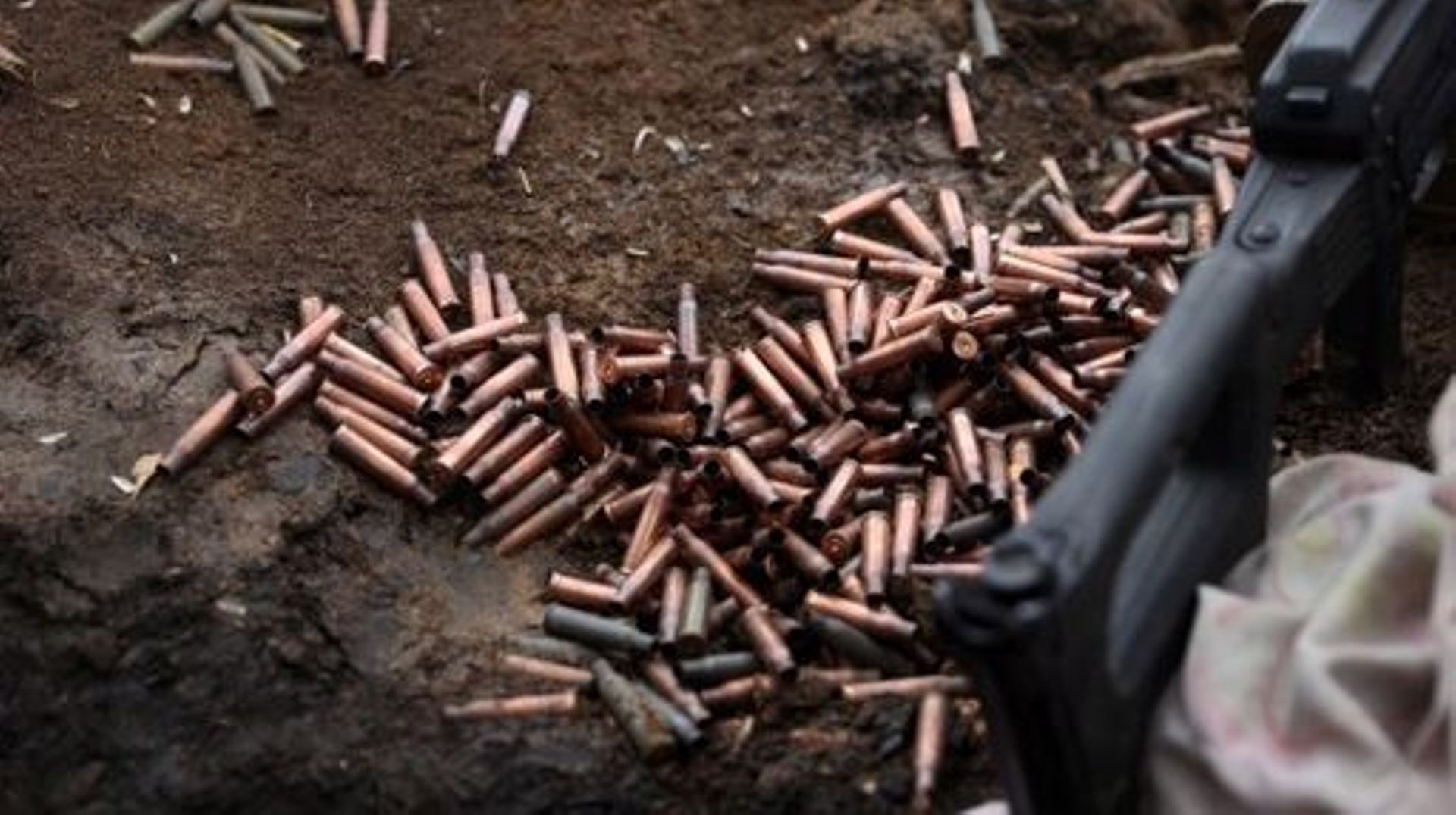 This photograph shows cartridge cases of the Ukrainian army on the frontline with Russian troops near Vugledar, Donetsk region, on February 27, 2023.  Anatolii Stepanov / AFP