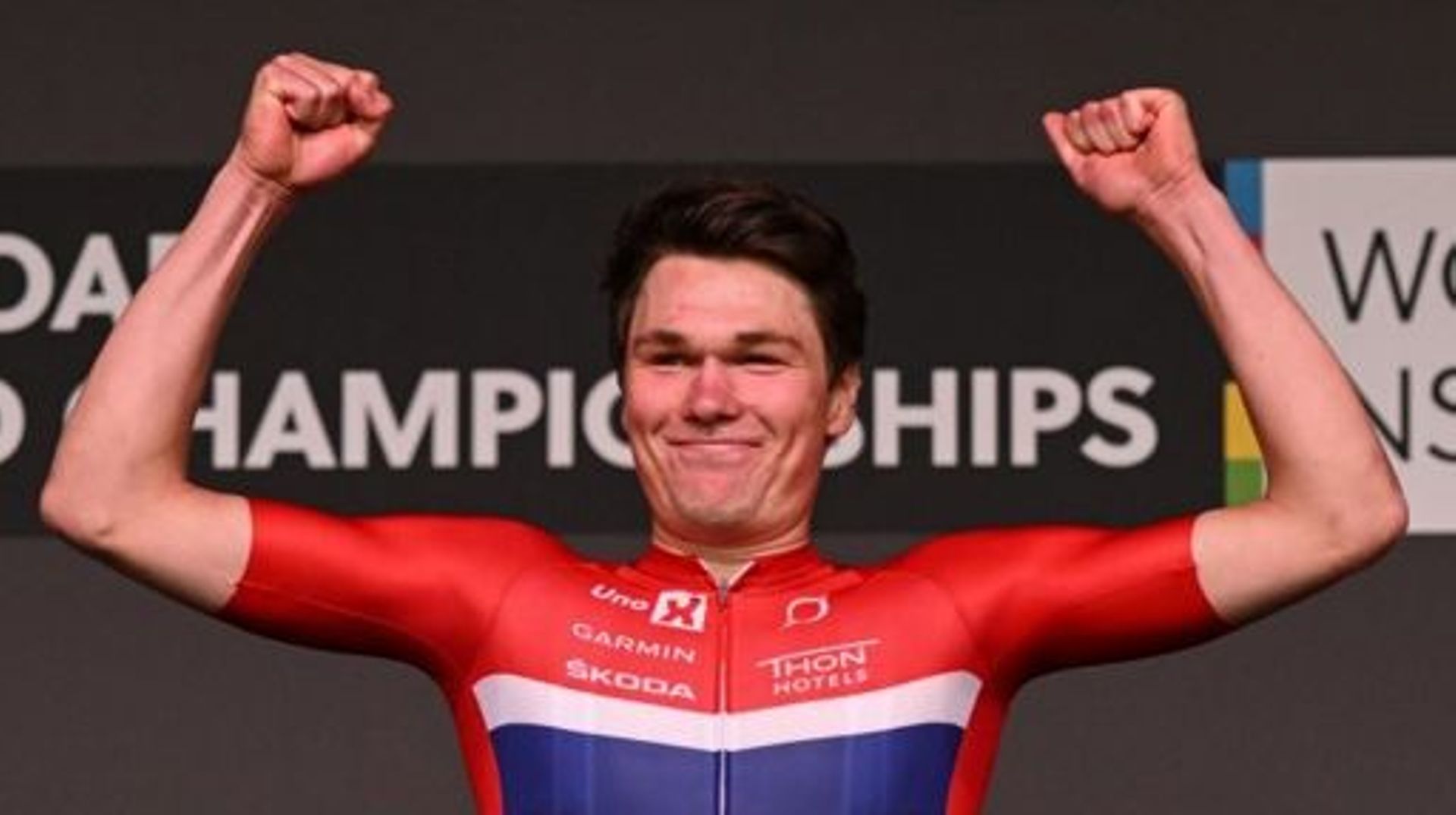 Norway’s Soren Waerenskjold celebrates on the podium after winning the men’s under-23 individual time trial cycling event at the UCI 2022 Road World Championship in Wollongong on September 19, 2022. WILLIAM WEST / AFP