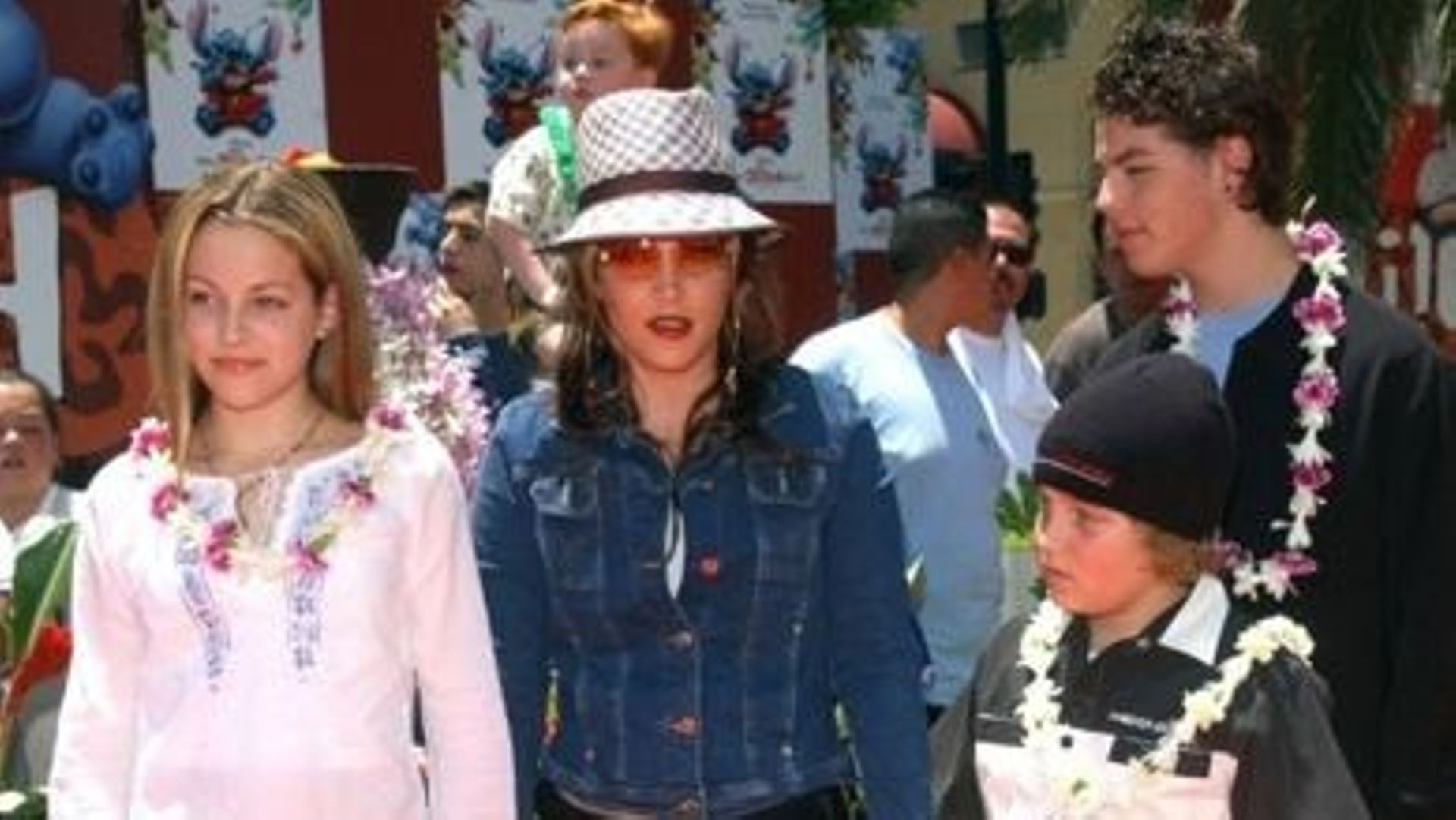 (FILES) In this file photo taken on July 16, 2002 Lisa Marie Presley and her children Benjamin Keough (R),  Riley Keough (L), and her half-brother Navarone Garibaldi (back) attend the premiere of "Lilo and Stitch" at the El Capitan theatre in Hollywood. L
