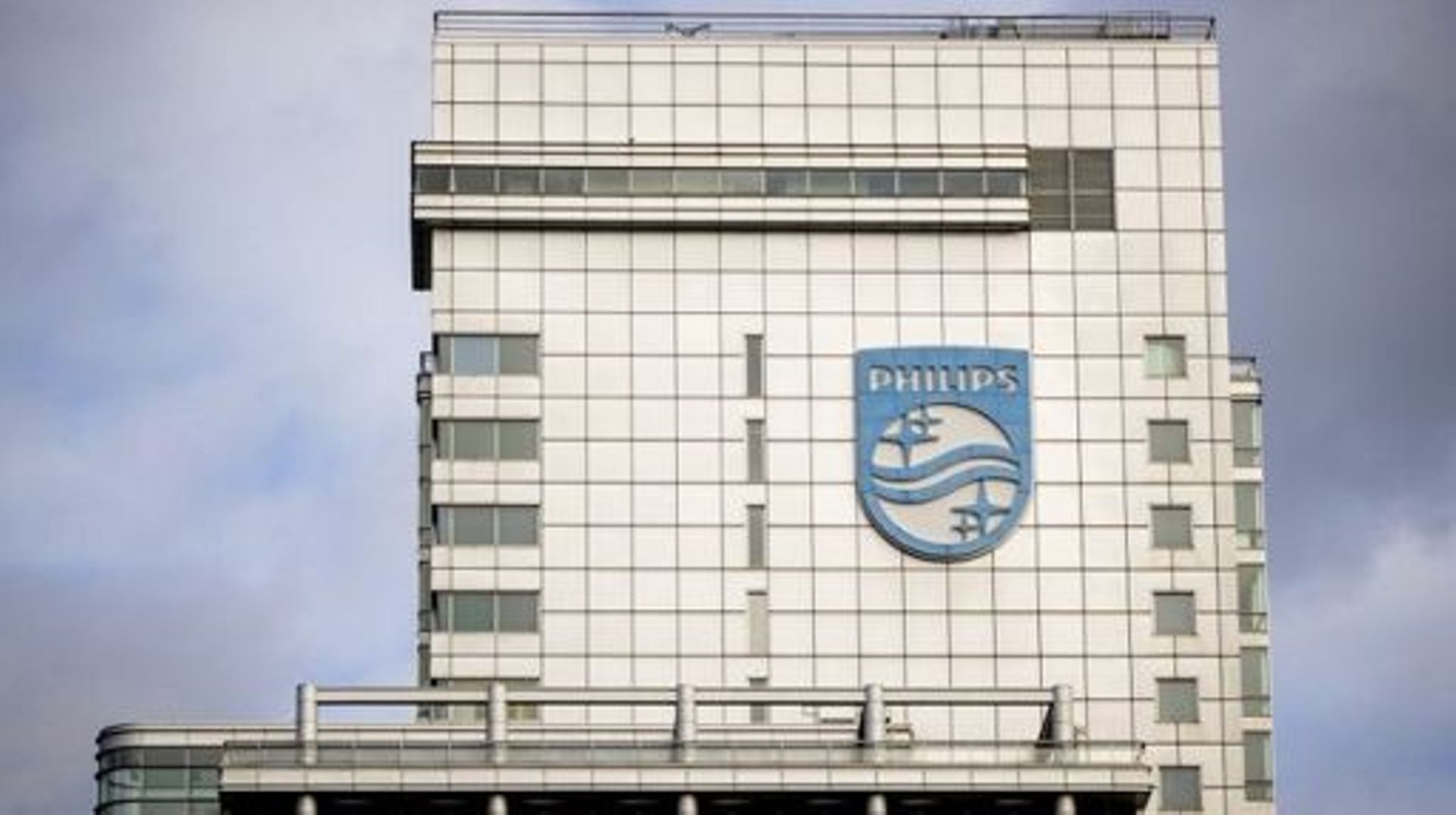A photo shows the logo on the facade of the headquarters of Dutch medical and consumer electronics manufacturer Philips in Amsterdam on October 23, 2022. Dutch medical device manufacturer Philips said on October 24, 2022, it will slash 4,000 jobs after a 
