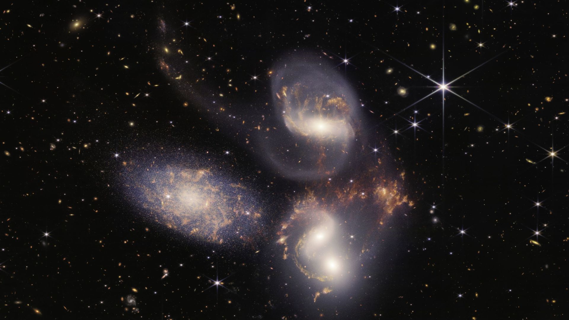 In this handout photo provided by NASA, NASA’s James Webb Space Telescope reveals Stephans Quintet, a visual grouping of five galaxies, in a new light on July 12, 2022 in space. This enormous mosaic is Webb’s largest image to date, covering about one-fift