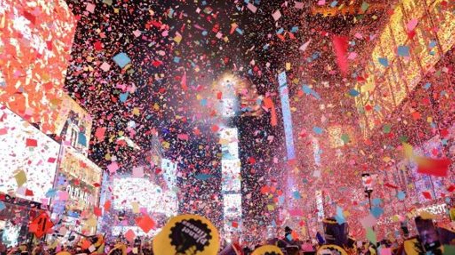 Onlookers watch as confetti fills the air to mark the beginning of the new year, in Times Square, New York City, on January 1, 2023.   Yuki IWAMURA / AFP