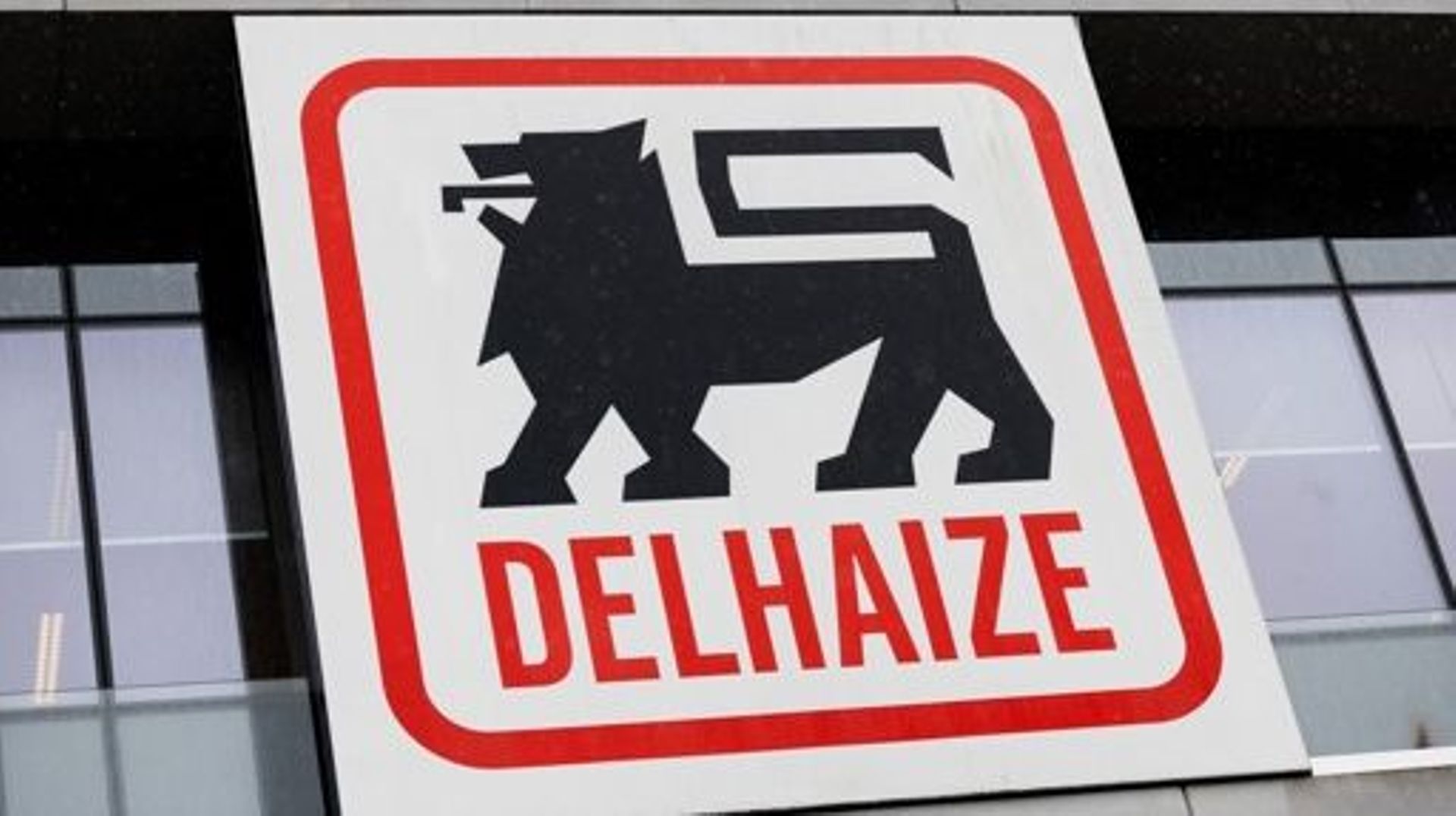 The Delhaize logo pictured during a meeting of the trade unions and direction of supermarket chain Delhaize, in Zellik, Tuesday 14 March 2023. The supermarket chain recently announced its plan to sell their remaining company-owned stores in Belgium, over 