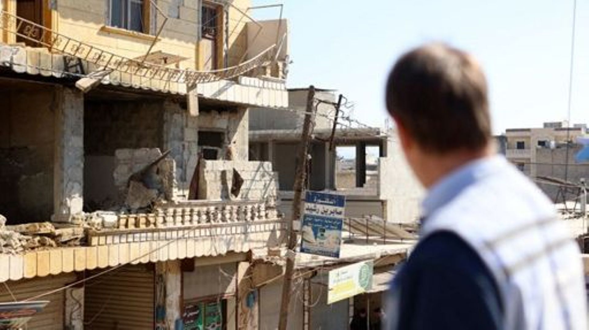 United Nations deputy regional humanitarian coordinator David Carden stares at buildings damaged in the February 6 deadly earthquake that hit Syria and Turkey, during the visit of a UN delegation to the rebel-held town of Jindayris, on February 18, 2023. 