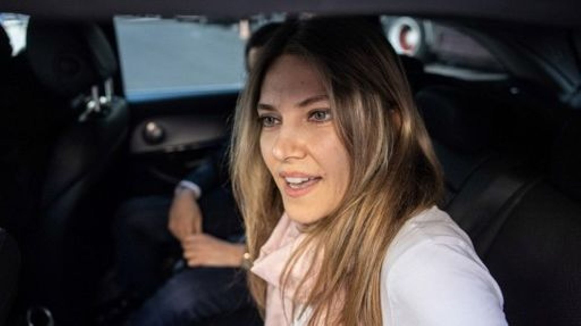 Greek MEP Eva Kaili smiles in the back of a vehicle arrives at her home in Brussels upon her release from Haren prison, in Brussels on April 14, 2023. Greek MEP, Eva Kaili, who is the last suspect detained in a Belgian probe into alleged bribery by Qatar 