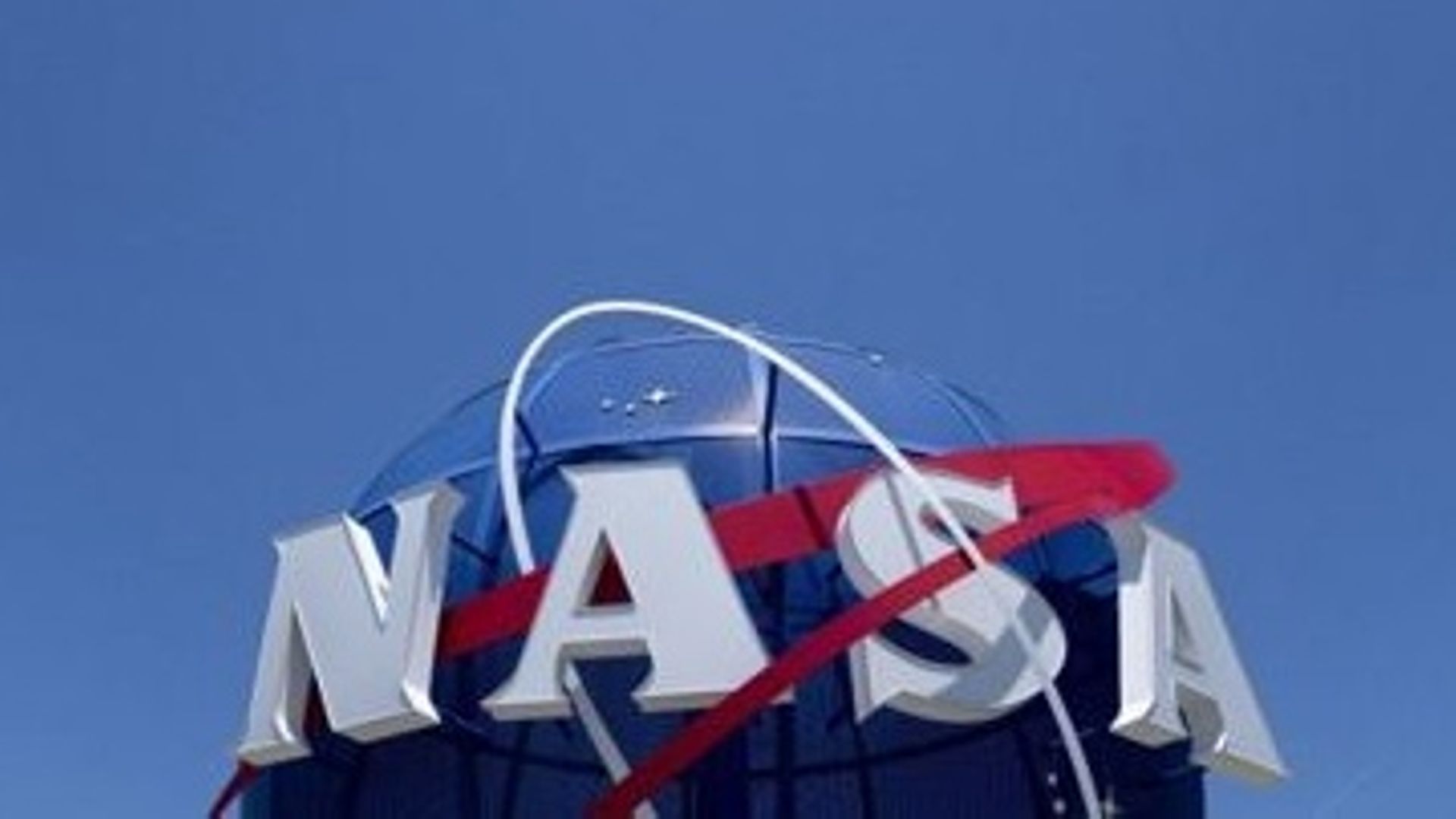 A sign displays the NASA logo outside of NASA Langley Research Center in Hampton, Virginia, on June 15, 2022. Stefani Reynolds / AFP
