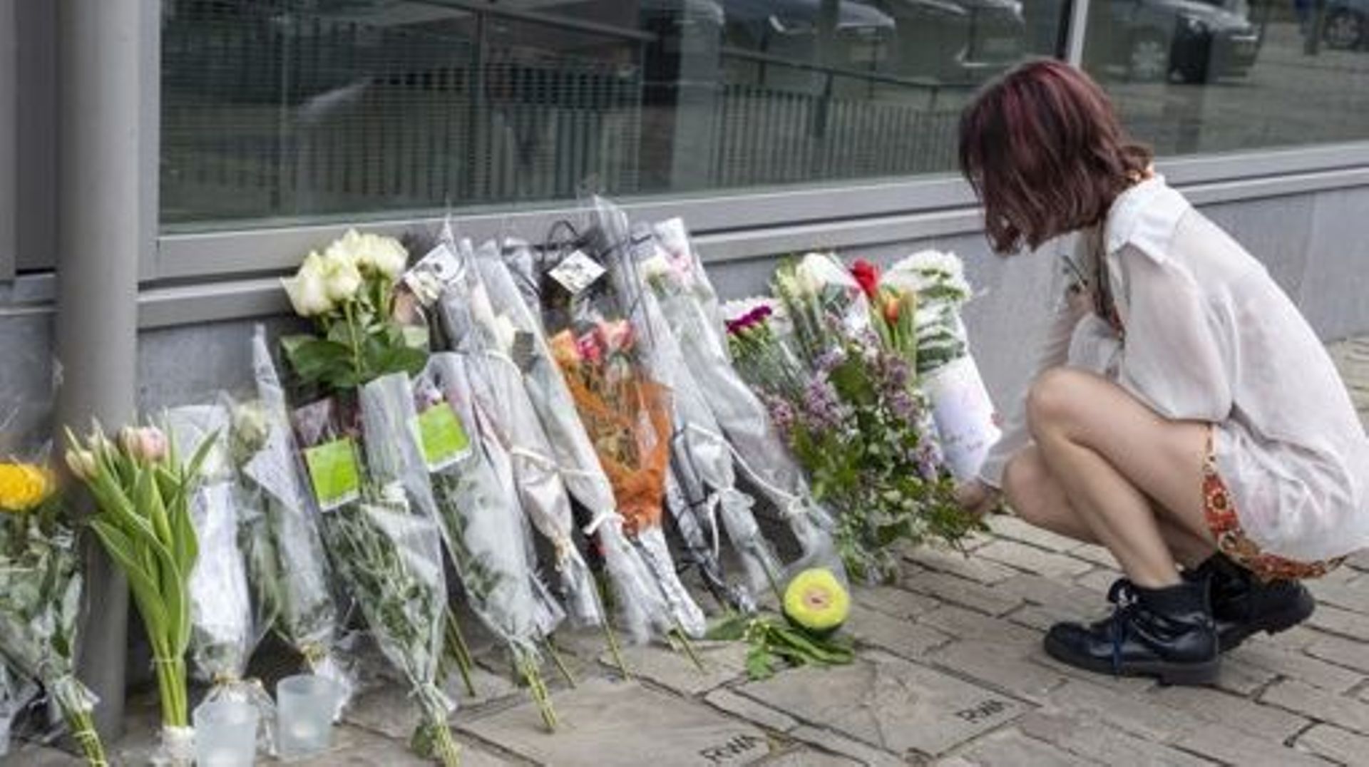 People have posed flowers outside of the building of the Zaventem train station, Saturday 06 May 2023. The young man who died on Friday afternoon in a fight at Zaventem station has not yet been identified. There are strong suspicions that it concerns a 23