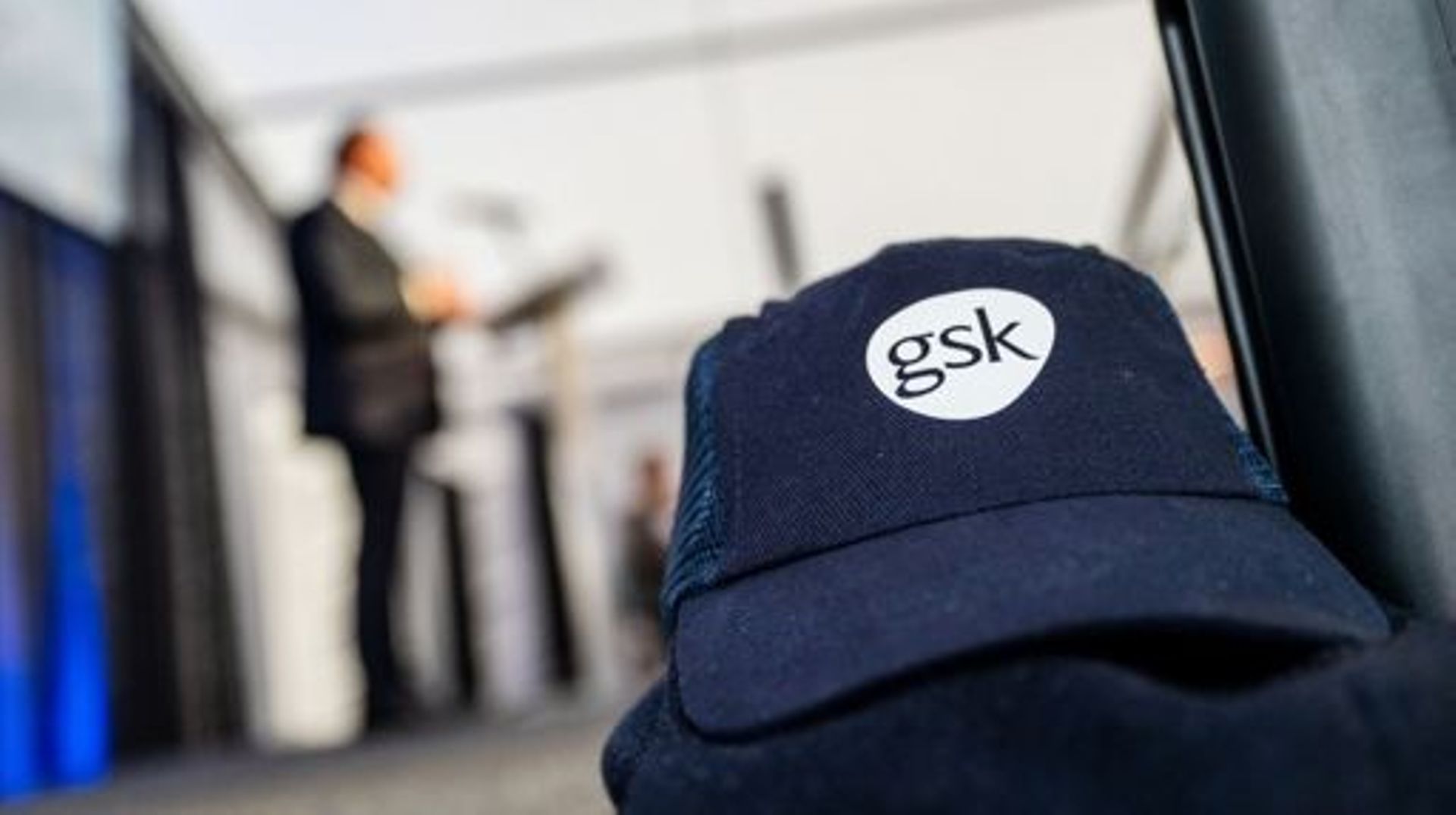 Illustration picture shows the GSK logo on a cap during the placement of the first pillar of the future GSK pharmaceutical logistics hub in Gembloux, Tuesday 20 December 2022. The future logistics center will have an impressive storage space for vaccines.