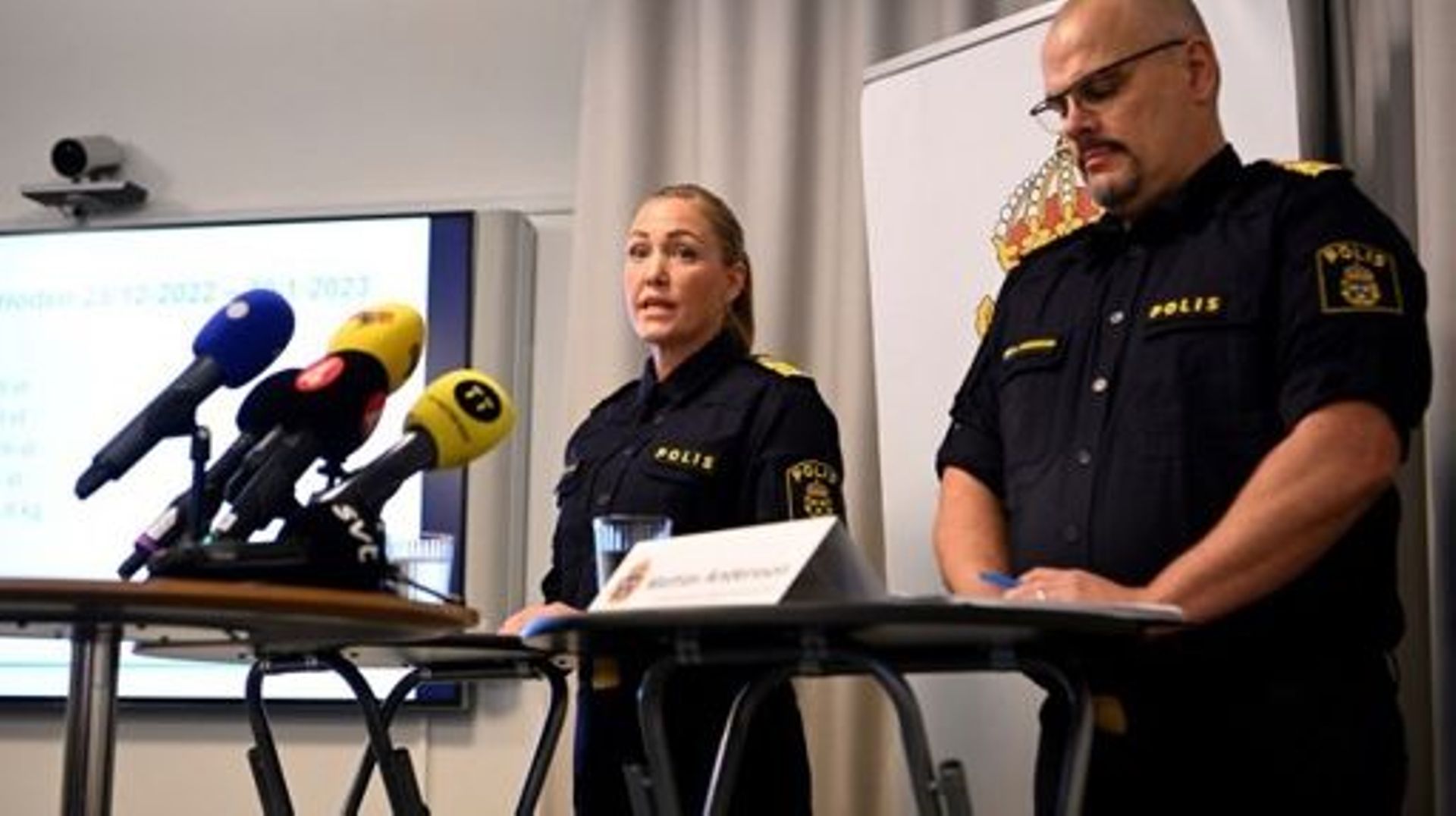 Acting police regional chief Mattias Andersson (R) and police chief of command Hanna Paradis hold a press conference on the recent acts of violence in the Stockholm region, Sweden, on January 20, 2023.   Jessica Gow / TT / TT NEWS AGENCY / AFP