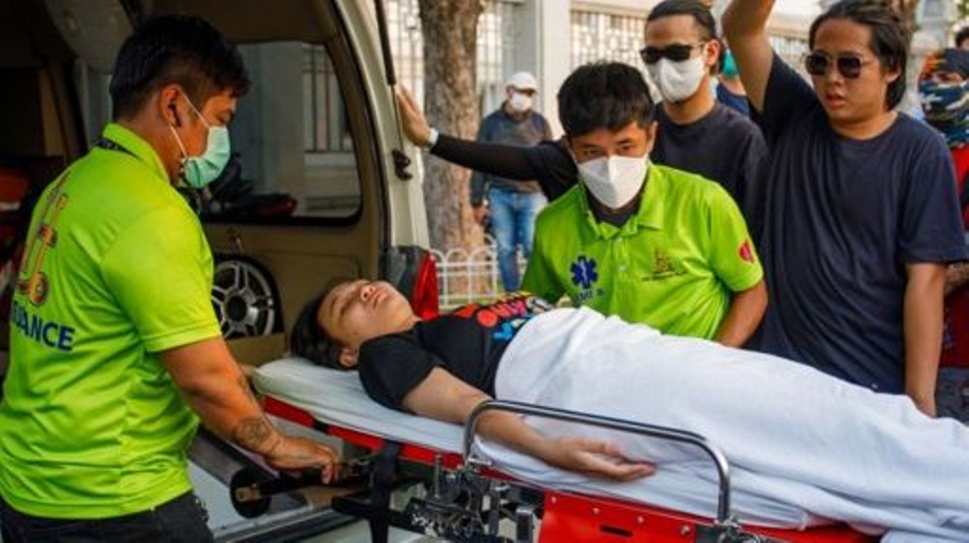 This photo taken on February 24, 2023 shows Thai political activist Tantawan "Tawan" Tuatulanon being transported on a stretcher to continue a hunger strike outside Thailand’s Supreme Court after being released from Thammasat Hospital in Bangkok. Thai pol