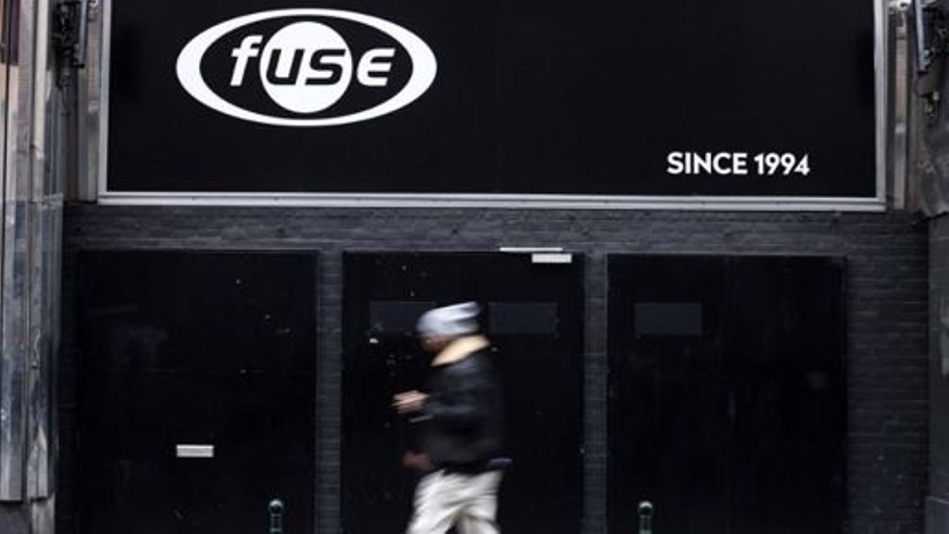 A pedestrian walks past the Fuse nightclub, in Brussels, on January 13, 2023. The decision stems from an adjacent neighbour who complained about the sound emanating from the nightclub. As a result, regional authorities demanded that the venue play music
