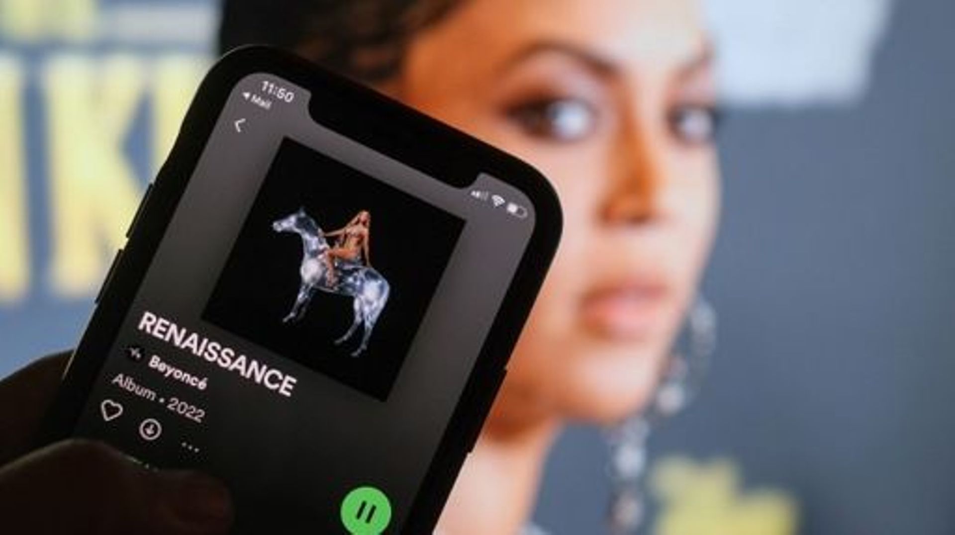 In this illustration photo taken July 28, 2022 in Los Angeles, Beyonce's new album "Renaissance" is playing on a smartphone with a picture of the singer in the background. Beyonce, the paradigm-shifting music royal whose art has long established her as on