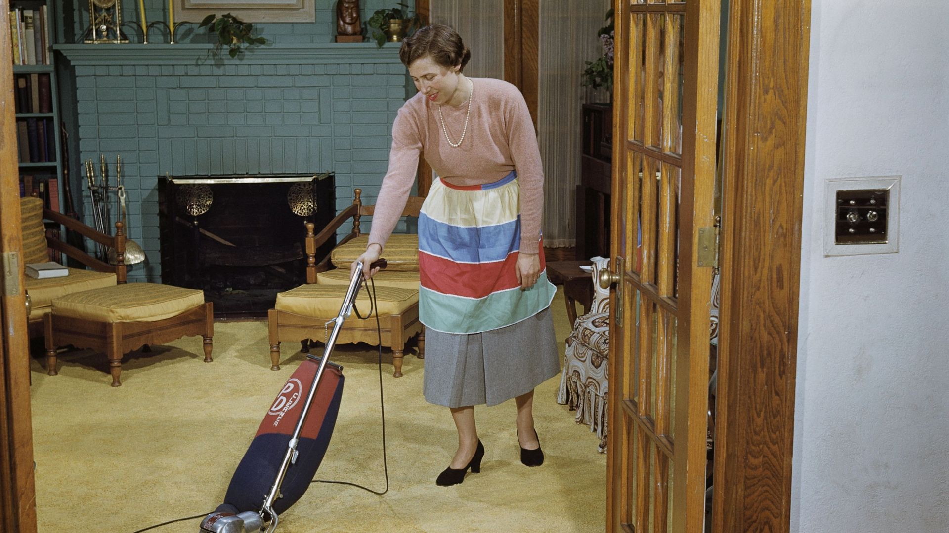 Woman Vacuuming Living Room