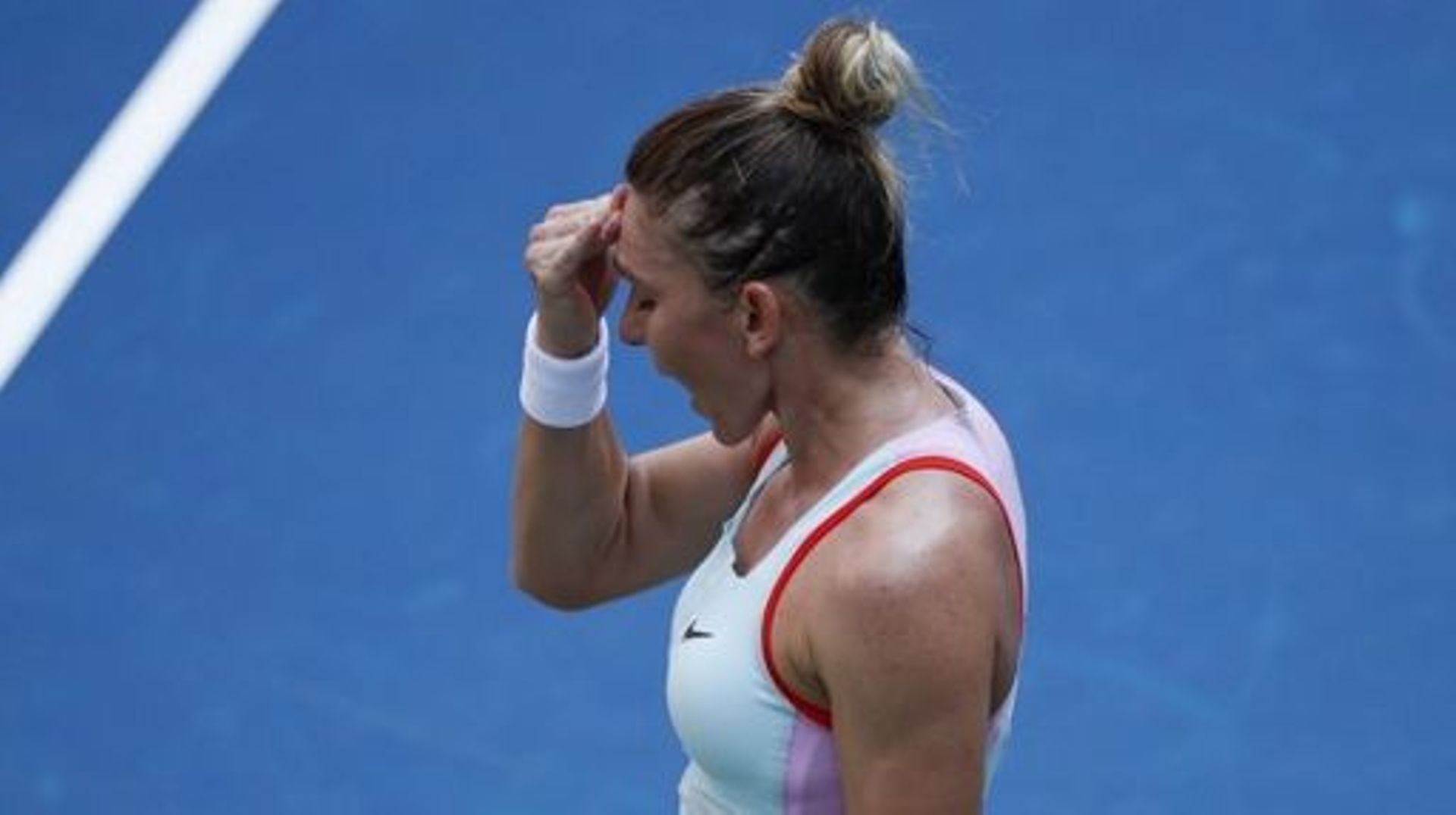 Simona Halep of Romania reacts as she plays against Daria Snigur of Ukraine during their 2022 US Open Tennis tournament women’s singles first round match at the USTA Billie Jean King National Tennis Center in New York, on August 29, 2022. KENA BETANCUR /