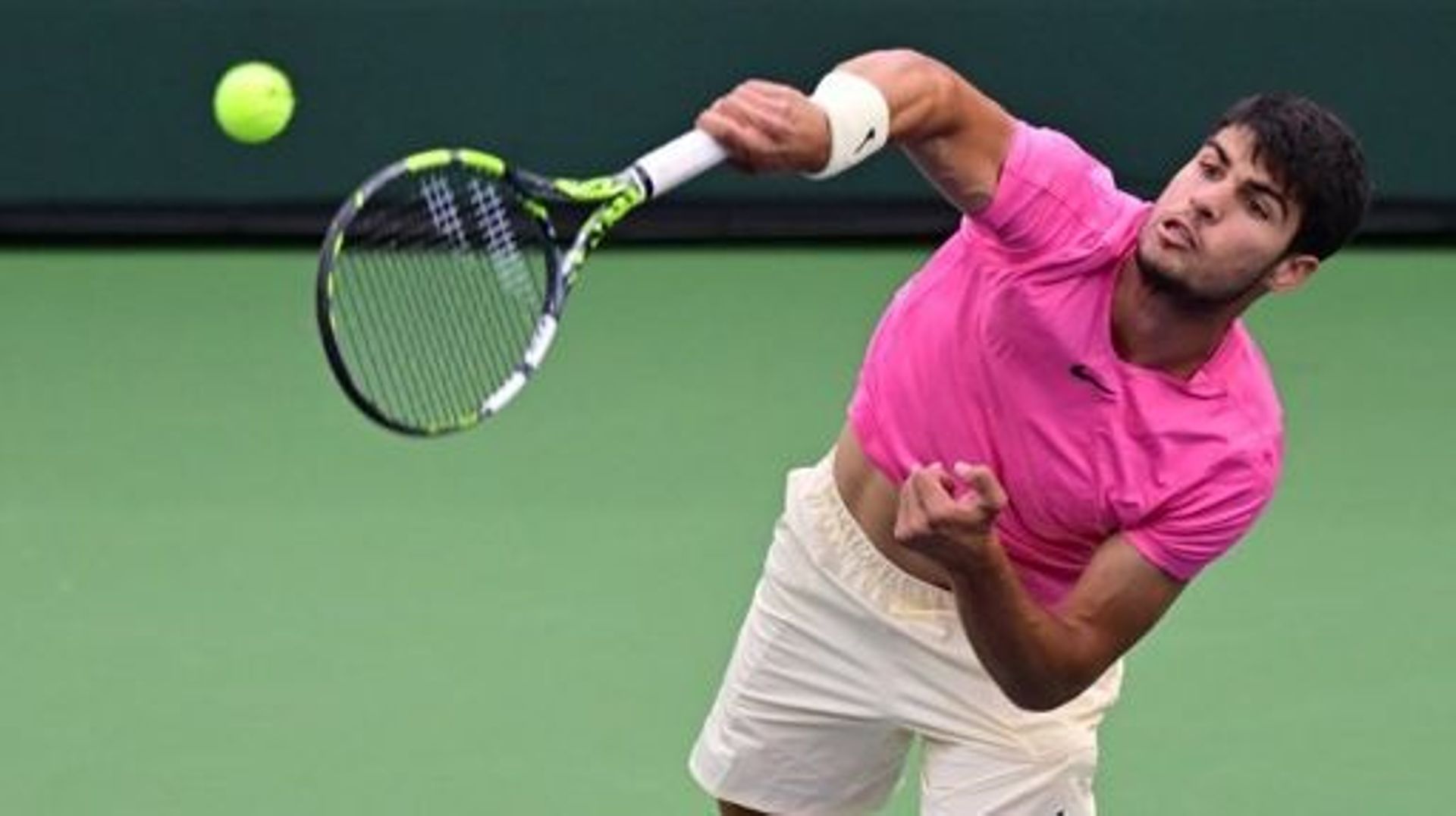 Carlos Alcaraz of Spain serves to Daniil Medvedev of Russia in the men's final at the 2023 ATP Indian Wells Open on March 19, 2023 in Indian Wells, California.   Frederic J. BROWN / AFP