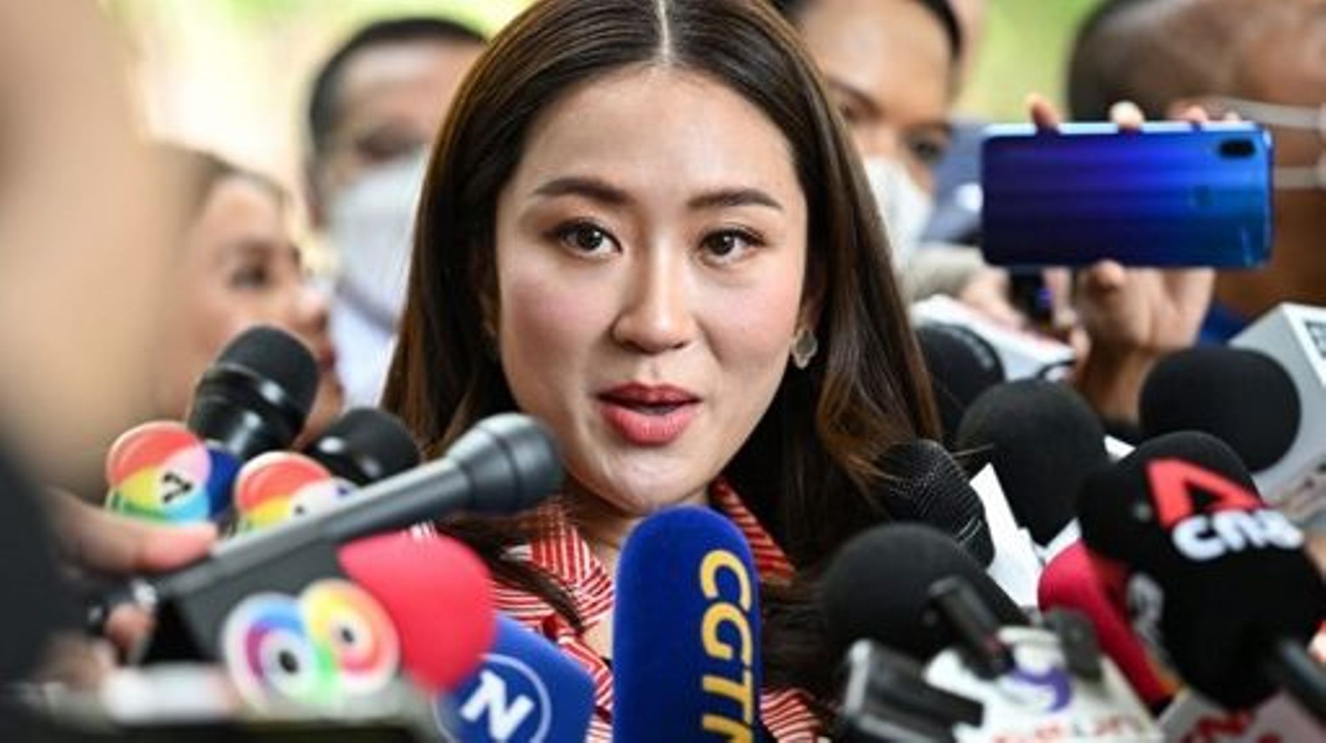 Pheu Thai Party's prime ministerial candidate Paetongtarn Shinawatra speaks to the press after casting her ballot at a polling station during Thailand's general election in Bangkok on May 14, 2023.  MANAN VATSYAYANA / AFP