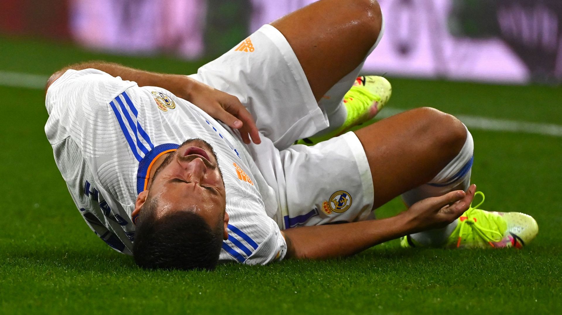 Belgian forward Eden Hazard lies on the pitch after being fouled during the Spanish League football match