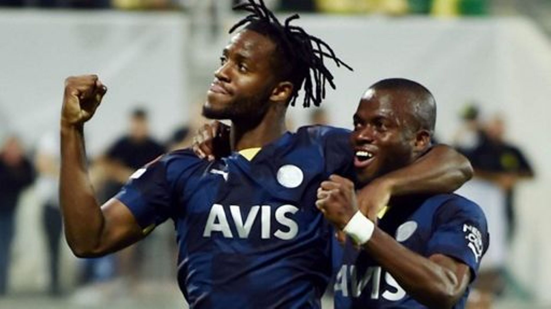 Fenerbahce's Belgian forward Michy Batshuayi (L) celebrates, with Fenerbahce's Ecuadorian forward Enner Valencia, after scoring the second goal during the UEFA Europa League group B football match between Cyprus' AEK Larnaca and Turkey's Fenerbahce at the